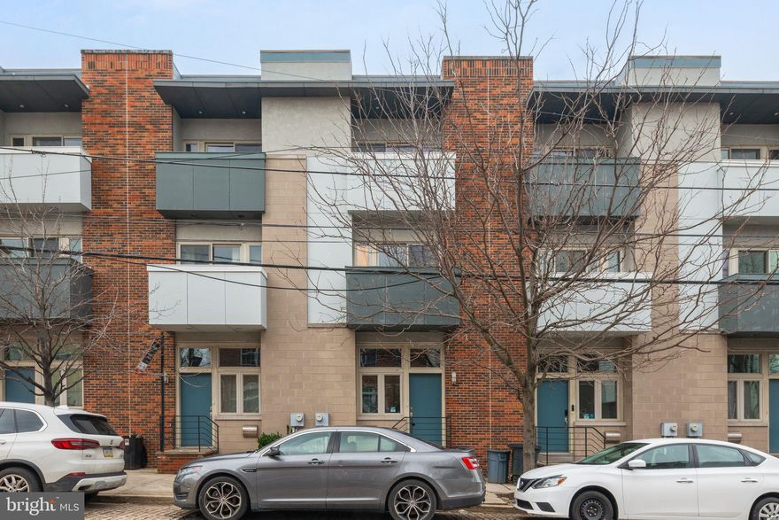 Welcome Home to 412 Luxe Community. This  townhome with one car parking is a must see! Enjoy the luxuries of this home features: Hardwood flooring throughout, high ceilings, tons of windows with  natural light and recessed light.  Entry level features open floor plan, powder room, modern, kitchen featuring dark wood cabinets, white quartz countertops, tile backsplash, stainless steel appliances and  door leading out to a court yard.  ! Upstairs are two  spacious bedrooms with tons of closet space leading out to a balcony.  two full bathrooms. Third floor level you will find great size bedroom leading out to a balcony and full size bathroom. Finally, on the top floor you will find a wet before leading out to your private roof deck with incredible bridge and skyline views! If all that isn't enough, this home is perfectly located blocks from all that Northern Liberties and Old City have to offer!