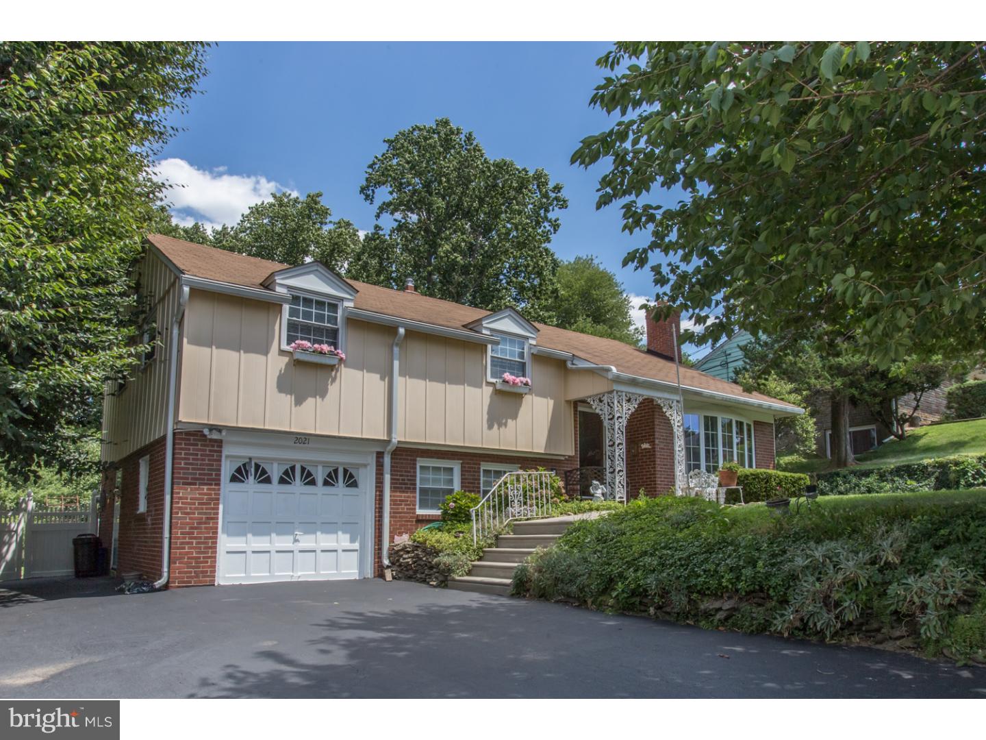 A Warm Welcome to 2021 Springhouse Road! Located in the heart of Broomall...Beautiful Langford Hills with stunning curb appeal. Slated entrance foyer, living room with fireplace, dining room with built in buffet hutch, kitchen includes newer appliances and sliding doors to a brick patio.  Master bedroom with full bath, 2 large bedrooms plus walk up to bonus room or 4th bedroom. A private backyard oasis is sure to capture your heart at first sight! In ground pool with slide, basketball court, seasoned landscape, backs to township park! Great bones, solid built home, updated electrical, hardwood floors under all carpeted areas and foyer. Heater and central air are less then 3 years old, 1 car extra large garage, parking for 4 cars. Convenient to I-476, award winning schools, good taxes... Don't miss the opportunity call this well maintained house, "HOME".