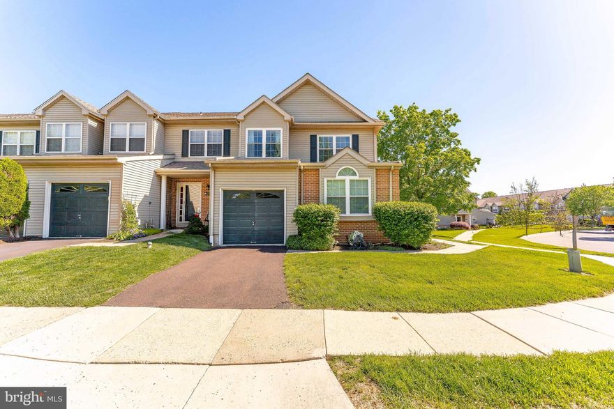 Welcome to 112 Harvard Drive – a beautifully maintained 3-bedroom, 2.5-bath end-unit townhouse located in the desirable College Woods community of Trappe. As you enter the home, you're greeted by a welcoming foyer with durable laminate flooring, crown molding, and a ceiling light—setting the tone for the style and comfort found throughout. The spacious living room features a cozy gas fireplace and elegant crown molding, flowing seamlessly into a bright dining area enhanced by a large bay window and additional crown detailing. The kitchen is a chef’s delight, offering tile flooring, granite countertops, stainless steel appliances, an island with seating, recessed and pendant lighting, and space for a breakfast nook. A sliding glass door leads out to the deck, perfect for outdoor dining or relaxing. A stylish powder room with tile flooring and a pedestal sink, along with a versatile home office featuring vaulted ceilings and an arched window, complete the main level. Upstairs, the primary suite offers a peaceful retreat with carpeting, a semi-vaulted ceiling, ceiling fan, and a closet. The en-suite bathroom boasts a double-sink vanity, tiled flooring, a walk-in closet, a jetted soaking tub, and a walk-in shower. Two additional bedrooms offer ample space, with chair rail accents and beadboard detailing in the third bedroom. A second full bathroom with tile flooring and a tub/shower combo serves this level. The third level features an unfinished attic/loft with vaulted ceilings, offering excellent potential for a bonus room or additional living space. Downstairs, the finished basement is perfect for entertaining, complete with a second gas fireplace, plush carpeting, and a built-in bar. The basement also houses the home’s utilities for added convenience. Located just off Main Street, this home is minutes from local shopping, dining, and community amenities. With its ideal location and thoughtful features throughout, 112 Harvard Drive is the perfect place to call home. Don’t miss your opportunity—schedule your tour today!