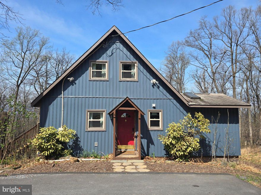 Turnkey Mountain Cabin | Getaway Home or Income Property | Selling Fully Furnished with Adjacent Half-Acre Lot Rare opportunity — fully permitted cabin near Shenandoah National Park with an active Conditional Use Permit and proven Top 5% Airbnb track record. Use as a personal getaway home, active STR, or both — sells completely furnished. Features west-facing sunset views, large outdoor deck, private hot tub, heated bathroom floors, wood stove, game field for cornhole, high-speed internet, cell phone reception, and paved driveway. Windows, siding, and HVAC installed in 2023. Unfinished basement for additional storage. Sale includes neighboring half-acre lot (Lot 23C 2 2 78) — buildable or natural buffer.