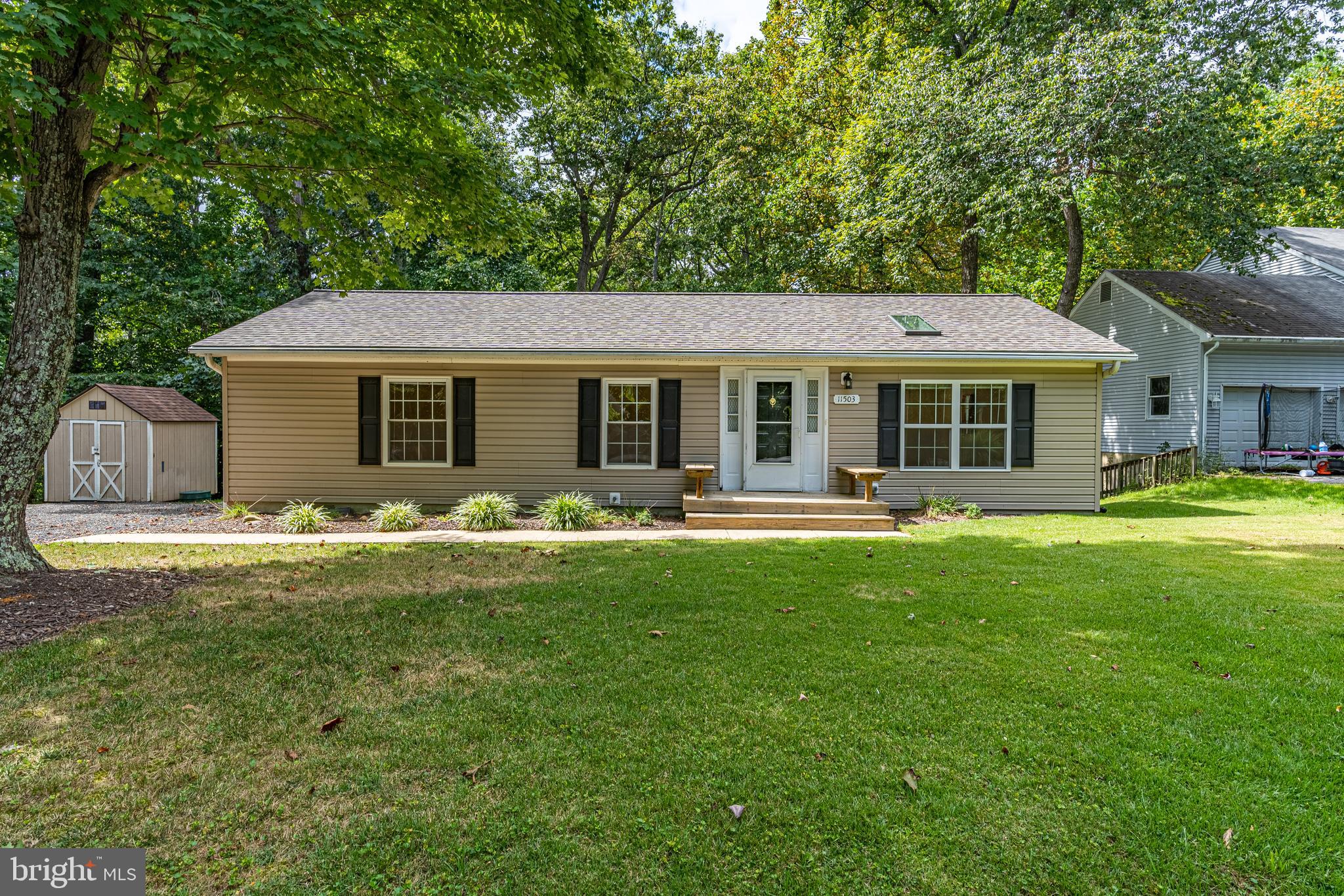 Enjoy one level living in this charming 3 bedroom, 2 bathroom rambler in Chesapeake Ranch Estates. Inside you'll find an open concept living room/eat-in kitchen with cathedral ceilings and a skylight for added natural light. The primary bedroom features an en-suite bathroom. Just steps off of the kitchen is a back deck for outdoor enjoyment. Continuing outside, you'll find ample parking space in the driveway, a storage shed, and a quiet lot that backs to trees. This home has been meticulously maintained. Brand new washer & dryer, new roof & skylights installed in 2020, hot water heater & crawlspace barrier installed in 2016. The windows and gutter guards both come with a transferable warranty. In addition, the seller is offering a 1-year HSA home warranty. The neighborhood offers wonderful amenities including beaches on the Chesapeake, Lake Lariat, a playground, and close proximity to Solomons Island and NAS Patuxent River.