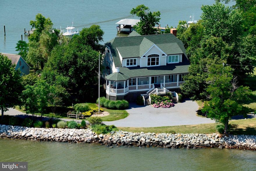 Magnificent water views from every room in this custom-built waterfront contemporary! Panoramic views over the Chesapeake Bay all the way to the Bay Bridge from the front & even more water views of Parish Creek in the back. Fully updated & gorgeous gourmet eat-in kitchen with stainless steel appliances, palladium windows, 2 fireplaces, pine floors throughout, 10" ceilings, and all bathrooms upgraded! Immediate Chesapeake Bay access and deep-water pier. Protected water on Parish Creek side. Absolutely stunning! Less than an hour from DC and 45 minutes to Annapolis. Co -listed with Marc Bertinelli