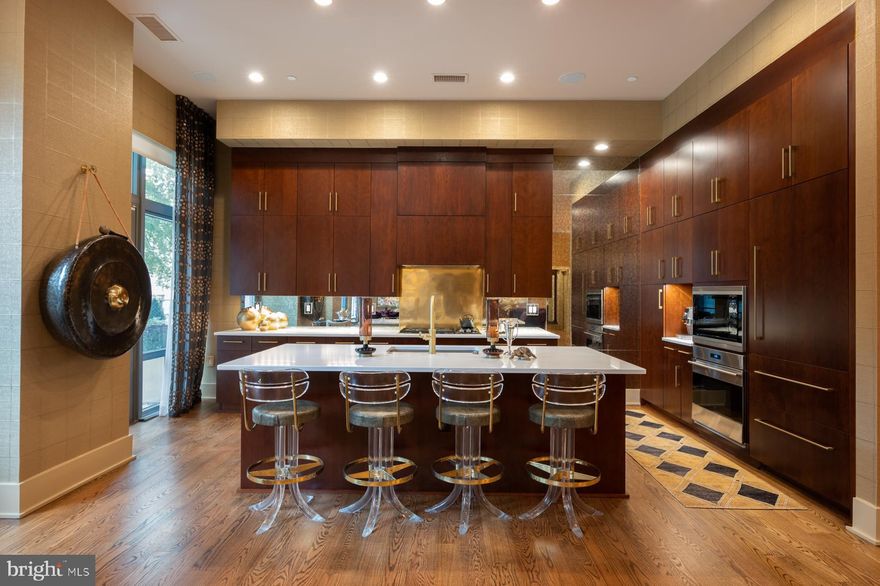 Soaring 11 ft ceilings, sprawling private terrace, custom finishes, and no detail has been overlooked in this residence. The gourmet kitchen features appliances from Wolf and Sub-Zero; custom cabinets, copper backsplash, and a large island. The primary suite features spacious closets and an en suite bathroom with zero entry shower, marble tile, and fixtures by Waterworks. The unit includes automated shades and Starr Savant system equipment for automation of home lighting, audio, and includes recessed speakers in the ceiling. Three assigned, underground, parking spaces are included as well as a private storage unit. The Oronoco is a full-service building offering Concierge, 24-hour security, meeting room, children's room, fitness center, yoga studio, outdoor heated pool, and dog wash station. The community is located on the banks of the Potomac River, just a few blocks from the shops and restaurants on King Street. Enjoy Oronoco Bay Park and the walking/bike trail along the river. This is one level living at its finest!