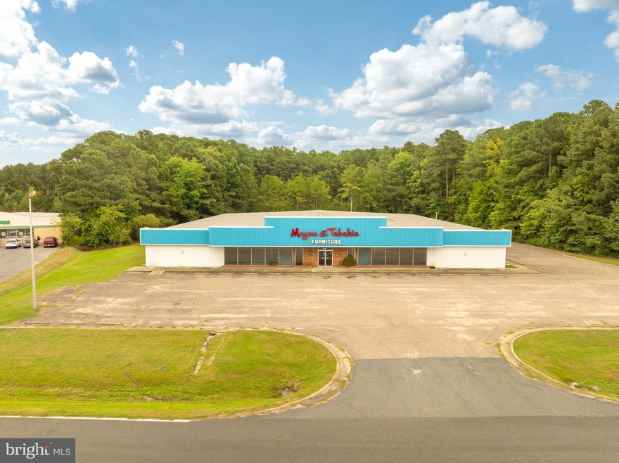 Spacious 25,200 sq ft building with over 300 ft of frontage on US Rt. 13. This property has capacity for 60+ vehicle parking and 2 curb cuts providing smooth highway access. With over 22,000 average daily traffic, this location is a prime space to grow your business with maximum exposure. Located in the heart of Accomack County, and only 200 yards from a signalized intersection.  The loading dock and 8 ft roll up door make delivery and distribution seamless. The building features 3 bathrooms and 3 offices as well as showroom and warehouse space.  Total land area of over 4 Acres with an additional 1.9 contiguous acres that are available but not included.