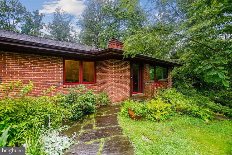 NEW PRICE!
ONE LEVEL LIVING ON 1.15 ACRE LOT IN PRIVATE SETTING!
Looking for a quiet retreat with nature but still want neighborly feel and close in location?
This is it! Fabulous custom built rambler on acre + lot, inside the beltway in the Sleepy Hollow/Lake Barcroft area of Falls Church. This home is on a circular street - lots of dog walking here and friendly neighbors.  Annual Halloween parade and other fun get togethers.

This custom built expanded rambler makes for easy living.  One level -plus lower level amazing suite for guests/aupair/teen.  Large picture windows with nature views create a peaceful space.  Spacious living room with wood floors and large horizontal shelving surround the gas fireplace - long mantel.  Elements of Frank Lloyd Wright and MCM style are apparent through out this home.  Skylights throughout.  Family room and kitchen along the back of the house are stunning with high ceiling, sandstone hearth and reclaimed beam mantel on stunning fireplace and, large windows to take in the scenery - long window bench for pup or human. Gorgeous European white oak flooring. Kitchen has cherry cabinets including wood paneled double drawer dishwasher.  Island and breakfast area. New quartz countertop and tiled backsplash - extra deep kitchen sink. Gas cook top and unique overhead hood.
Conveniently located laundry room with newish Electro lux washer and dryer, sink and cabinets. Spacious bedrooms. Newly remodeled custom baths - gorgeous.  Porcelain tile flooring and wainscoting, MCM Greenfield cabinetry, quartz countertops, spot resistant glass shower surround, LED lighting. 
Huge bonus room off the kitchen for offices/playroom/exercise. Garage with storage space on front of house.
Lower level accessed by stairs with bead board walls. Handsome suite with fireplace, mini fridge, lots of closet space, cork floor, lovely bath and private entrance with outside lamppost and stone walk way for privacy. 

This one of a kind home is owned by highly regarded contractor and designer - they have created a sanctuary.
The lot is stunning - perched on a hill with large level backyard - front yard is all perennial planting shrubs and gigantic azaleas!  Heated driveway so no problem in winter. This is a gardeners paradise loaded with hydrangea, cone flowers, astilbe,spirea, peonies, evergreens and so many more. Pathways throughout the yard, stone patio and 18x40’ level deck across the back of the house with raised seating section. Plus two sheds both with electricity! 

All this and close in to DC, easy access to  Rts. 495, 66, 50 and 7, Mosaic District is 10 minutes away.  Nearby grocery stores are Trader Joe’s, Whole Foods, Giant, Harris Teeter and Safeway! Wonderful restaurants. Great swim clubs just down the street, parkland nearby with Roundtree park and Mason District park - Thursday morning Farmer’s Market!  Come check it out! Priced to sell!
Life is good! Pull into driveway to visit.