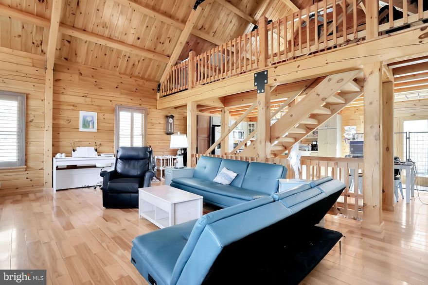 Nestled at the end of a cul-de-sac in the charming Cacapon South subdivision, this post and beam construction log cabin awaits new owners.  Imagine spending the winter enjoying the gorgeous stone fireplace or warm your home with two top of the line high efficiency gas furnaces.  A buried 500 gallon propane tank conveys with the home.  Built by Kuntz Brothers Builders, you will be impressed with the superior wall foundation, 5 inch solid wood hickory floors and outstanding craftsmanship.  Featuring a fully open unfinished basement, it's ready for your finishing touches.  Working from home? No problem as you have Xfinity Internet available.  Wired for ADT, this home comes with a home security system to ease your mind.  In the two car detached garage you will find plenty of space to store your vehicles, toys and hobbies.  The garage is wired with a 100 AMP sub electrical panel for your convenience.  Behind the property there are walking trails and a river, boasting plenty of privacy.  The current homeowners have replaced most of the appliances, added LED lights, added  a new 50 gallon hybrid water heater and Alexa ready smart lights.  Make the qauint town of Berkeley Springs your home!
*American Home Shield "Shield Complete" Warranty Included*