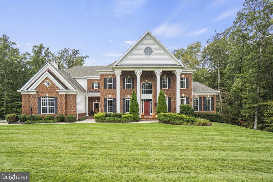 Assumable VA Loan at 3.875%! Welcome to your dream home - a luxurious oasis perfect for all your entertaining needs. This stunning property is designed to impress, from the elegant exterior to the sumptuous interiors that are sure to leave your guests in awe. 5 bedrooms, 5.5 Baths with 9,360 sq. ft on 3.55 acre cut-de-sac lot in "The Glens" neighborhood.  As you step into the foyer, you'll be greeted by soaring ceilings, a curved stairway, gleaming hardwood floors, and exquisite detailing with a ceiling medallion that sets the tone for the rest of the home. Whether you're hosting a cocktail party in the spacious living room, or gathering friends and family for a formal dinner in the grand dining room, this home is equipped with all the space and amenities you need to entertain in style. Enjoy reading your books in your own private library with beautiful wood shelving. Two sun rooms with  tile and tall windows saturate the home with natural light. The chef's kitchen is a showstopper, featuring top-of-the-line stainless steel appliances, custom cabinetry, full extension drawers with soft close and gorgeous granite countertops that make cooking and entertaining a joy. Two separate islands, one with a prep sink give plenty of room for the family chef. The Butler pantry with wine rack cabinet add extra storage for kitchen appliances and glassware. There’s even a cozy breakfast nook overlooking the landscaped backyard, where you can enjoy a cup of coffee or tea with your loved ones. Easily access the covered balcony from the kitchen with an additional access to the back deck with trex. The main level also features a spacious family room, perfect for movie nights or cozying up by the gas fireplace. Moving down the hall you will find the half bathroom on your way to the mudroom, which gives you additional access to the front of the house as well as the 3-car garage. The spacious Primary Bedroom, located on the second floor features a private covered balcony, the perfect spot to unwind after a long day. The spa like Primary Bath has dual vanities with ample storage, a soaking tub and an oversized shower with tiled walls and  glass doors. The large walk-in closet completes the Primary Suite. Dual access to the laundry room from the hall and Primary Suite make laundry a breeze. The Kenmore Elite front loading washer and dryer convey with the home. Three additional bedrooms with ensuite full bathrooms complete the second floor. Step inside the finished basement and you'll find yourself in the heart of your very own personal bar, with sleek granite countertops, refrigerator, and stunning modern finishes. Entertain your guest with a game of pool or ping pong, or kick back and enjoy the latest thriller in your theater room. Enjoy your morning workout in the home gym. Host guest with the private bedroom and full bath overlooking the brick patio with fire pit. Step down to the second patio and soak in the hot tub.As dusk settles over the gardens, the property becomes a spectacle to behold, thanks to the outdoor landscaping lighting. Easily store lawn equipment in the carriage house style shed with a second space added and electricity. Additional features of the home include an Eaton Air cooled emergency gas generator, central vacuum system with crumb catchers in the kitchen and primary bath, Honeywell HVAC Humidifier, surround sound system on all three floors.Located in a prestigious neighborhood, this luxurious home is a rare find, offering the ultimate in privacy, serenity, and elegance. Contact us today to schedule your private showing and experience luxury living at its finest!