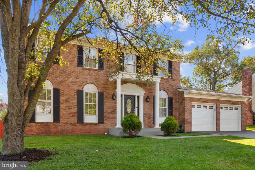 Remodeled and updated brick front colonial with legal main level bedroom that could also serve as a second family room or bonus room!  Spacious half bath on main level also has plumbing intact and can easily be converted back to a full bathroom!  The main level features hardwoods, crown molding and tons of recessed lighting throughout. The completely updated and renovated gourmet eat in kitchen features beautiful cabinetry, tons of counter space with room for up to three stools and stainless steel appliances. The kitchen opens to the family room with wood burning fireplace and custom mantle. 
The large sunroom off the family room looks out over the backyard.. The upper level features the Primary Bedroom with ensuite bathroom and large walk in closet with built in shelving.  There are three additional spacious bedrooms upstairs and hall bathroom.  Fully finished basement could serve as in law or au par suite and is completely outfitted with functioning kitchen, full bathroom and bedroom (NTC).  Ideal for outdoor lovers with patio, playground and fully fenced yard.  Conveniently located in Cardinal Glen just off Route 7 with easy access to all Tyson's Corner, DC, Leesburg, and the rest of NoVA. Multiple choices within 5 minutes for shopping, dining, retail, parks, and more.