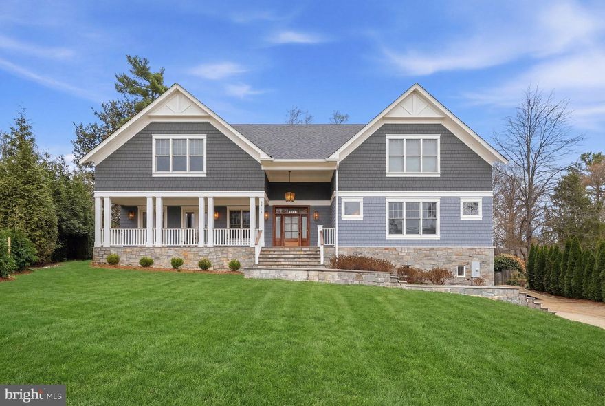 This stunning shingle-style residence feels virtually brand new, having been only lightly lived in since it was built. Designed with grand scale and exceptional natural light, the home features soaring ceilings, expansive windows, and beautifully crafted millwork throughout.

A dramatic two-story foyer with floor-to-ceiling windows creates a striking first impression and fills the home with natural light. The heart of the home is the spectacular gourmet kitchen and family room, an enormous open space designed for both everyday living and effortless entertaining. The chef’s kitchen is equipped with premium appliances and flows seamlessly into the sun-filled family room, overlooking the private backyard.

The outdoor living spaces are equally impressive. A charming full-length front porch welcomes guests, while the backyard offers a flat, beautifully landscaped setting with mature privacy trees, a large entertaining terrace, and a resort-style pool and jacuzzi—creating a true private oasis.

Additional highlights include a spacious home office, a massive mudroom conveniently located off the two-car garage, and a fully finished lower level featuring a home theater, game room, and wine cellar. Every bedroom is generously sized with its own en-suite bath, and 10-foot ceilings throughout enhance the home’s sense of openness and elegance.

With its thoughtful design, pristine condition, and exceptional indoor-outdoor living spaces, this home offers a rare opportunity to enjoy a nearly new luxury residence in an idyllic setting.