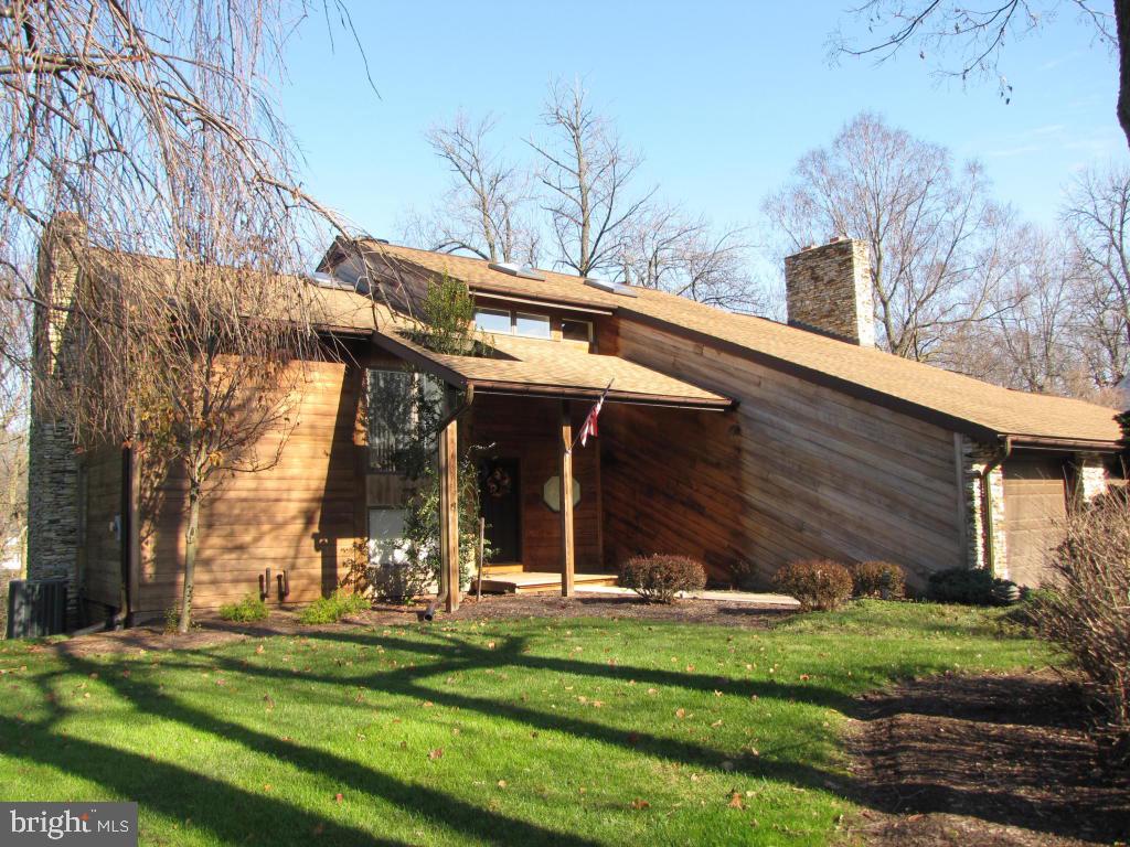 Stunning contemporary custom built with lots of thought for extra features that you expect to find in a new home. Spacious 4 bedroom, 5 bathrooms, 3 fireplaces,finished walkout basement. Screened porch & a deck look out to the backyard that borders a small stream. Large windows allow natural light to make this home warm & cheery. Call for a showing.