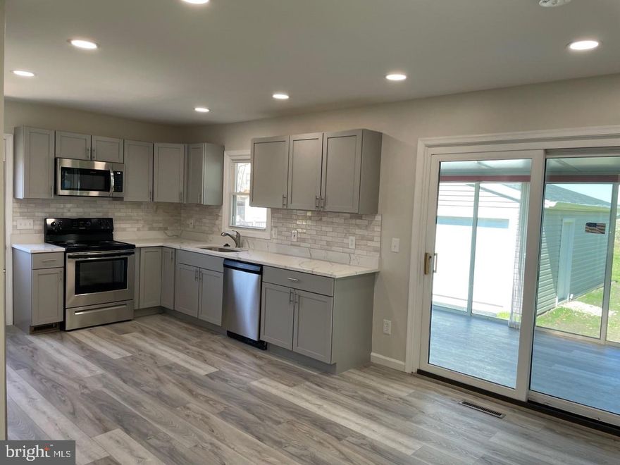 Updated and Remodeled in 2022 from top to bottom, inside and outside. The 2022 one level living home remodel included  3 bedrooms, 2 full bathrooms, brand new kitchen with stainless steel appliances, quartz counter tops, new cabinets, two updated bathrooms , new LVT flooring throughout the home. New roof, siding , gutters with leaf guard system. Enjoy quiet evenings or early mornings from the back porch that overlooks scenic farmland and where you can catch views of the Chester River. If your looking for a super clean and peaceful place to live this is the home. 2 car detached garage provides additional parking and storage. Community offered pool, marina, beach and club house. No smoking and no pets or animals.