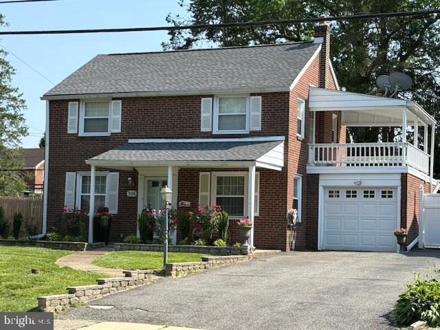 Outstanding Brick Colonial with versatile Family Room addition spanning the whole rear of the home!
This two-story property offers a wonderful sense of openness and natural light as you enter from the front porch. Inviting first floor boasts gleaming hardwood oak flooring throughout and a tasteful neutral palette. Generous Living Room has electric Fireplace focal point, ceiling fan, recessed lighting, and custom oak staircase tucked at rear wall for uninterrupted floor space and flow. Living Room opens into a handsome Family Room also with recessed lighting, table for dining or games and exit to patio/yard. Windows galore overlooking green yard space for a vibrant indoor/outdoor connection. Formal Dining Room features chair rail accent and corner windows. Updated Kitchen sparkles with white cabinetry and matching appliances, tasteful neutral Corian countertop, newly installed Whirlpool dishwasher, electric cooking and handy Breakfast Bar with two stools. Comfortable adjacent Family Eat-in Area features dramatic arch glass transom window, vaulted ceiling, elegant chandelier and side exit to brick patio and yard. Three nice Bedrooms and updated porcelain-tiled Bath with tub/shower and vanity on second floor. One Bedroom features an exit to a covered porch design with potential over the Garage. From the kitchen, a crafted oak staircase leads to a super-size lower level Recreation Room with ceramic tile flooring, recessed lighting and chair rail. Perfect for office space, exercise or play room, games and guests! Bright and practical 9x9 Laundry Room with newer GE washer and dryer (6/25) plus dramatic updated Full Bath with floor-to-ceiling porcelain tiling, large glass-enclosed shower. Two nearby double-louvered door closets with handy shelving. Generous level rear yard is fenced with playground area, plenty of space for activities and gardening plus two brick patios ideal for cookouts and conversation. Central Air plus ceiling fans throughout. Oil heat. One-car adjacent garage with interior access, private driveway for four vehicles. Ideal Springfield location near schools, shopping, transportation and recreation.