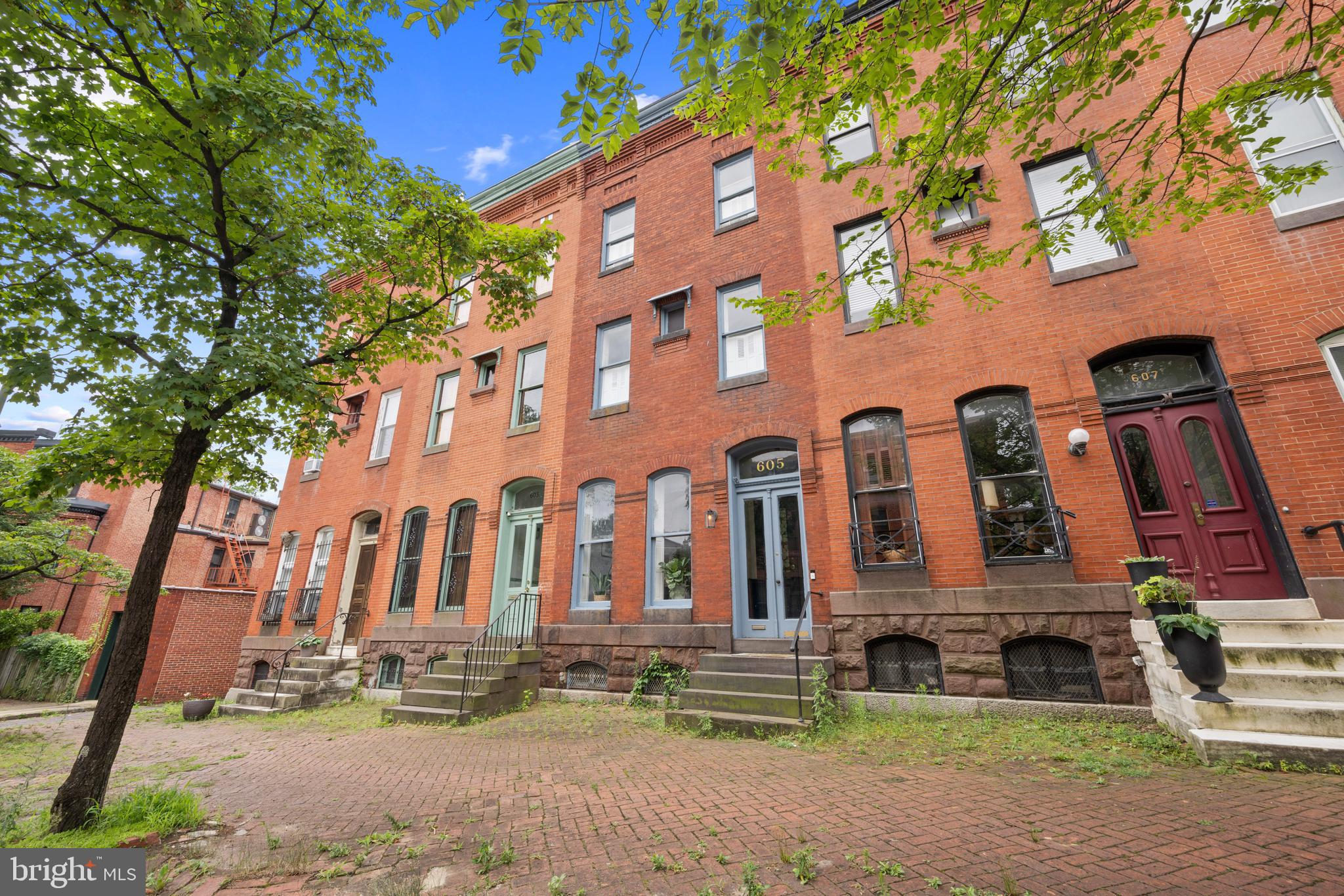 A beautifully updated 3-bedroom, 2.5-bath townhome in the vibrant Reservoir Hill neighborhood of Baltimore. This spacious home blends classic charm with modern finishes, featuring exposed brick walls, hardwood flooring, recessed lighting, and an open-concept main level. The gourmet kitchen is equipped with granite countertops, stainless steel appliances, ample cabinetry, and a large center island—perfect for entertaining. Upstairs offers three generously sized bedrooms, including a primary suite with a private bath and great natural light. Stylishly finished bathrooms throughout the home offer updated tilework and contemporary fixtures. The fully finished lower level provides additional living space ideal for a family room, office, or guest suite. Enjoy outdoor relaxation or entertaining in the fully fenced rear yard with patio space. Central A/C and in-unit laundry add to the convenience. Located just minutes from Druid Hill Park, the Maryland Zoo, MICA, Penn Station, and I-83—this home offers both comfort and connectivity. A must-see!