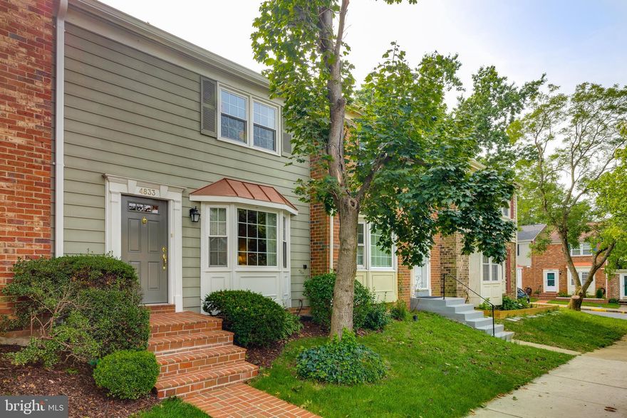 Pretty as a  picture!  Move-in ready 3/4 Bedroom,  3.5 bathroom  townhome.  Beautiful hardwood flooring and crown molding throughout main level.  Updated Kitchen with granite counter tops,  stainless steel appliances,  recessed lights,  under-counter lighting, and space for a table.  Inviting Living Room with bay-window.  Bright Master bedroom and new, fully remodeled bath with white vanity,  gray ceramic tile, glass doors. Full bathroom  and additional two bedrooms on top floor with laminate flooring.   Lower level offers Recreation Room, spacious Den/possible 4th bedroom with ample closet space and window,  full bathroom,  laundry and wet bar. Home features replacement windows,  six-panel doors, additional molding work.  Two assigned parking spaces #31. Community amenities: pool,  playground, common areas. Bus stop at front of community.   Within walking distance to shops, grocery, and restaurants.