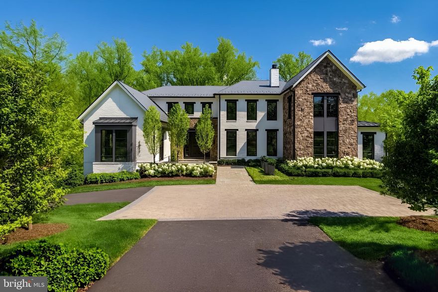 Breathtaking estate by Artisan Builders, located on a quiet cul-de-sac off prestigious Turkey Run Road in Langley Farms—McLean's preferred address. Backing to over 500 acres of pristine parkland, this private lot offers an unrivaled sense of seclusion and serenity. The stunning grounds, designed by award-winning landscape architect Charles Owens, include a sparkling pool, an outdoor kitchen, a cozy fire pit, and meticulously manicured spaces perfect for entertaining or serene relaxation. Upon entering, the foyer opens to the formal living room with a stately fireplace and a sunlit great room framed by expansive windows that offer sweeping views of the backyard oasis. The chef’s kitchen is a masterpiece, featuring top-of-the-line appliances, custom cabinetry, dual center islands, and a charming morning room. The main level also includes an elegant office and a well-appointed mudroom with a convenient and stylish built in dog crate. Upstairs, the luxurious owner’s suite is a sanctuary, complete with two spacious walk-in closets and a spa-inspired bath offering dual vanities and refined finishes. An additional family room, three en-suite bedrooms, and a dedicated laundry room complete the upper level. The lower level is designed for entertainment and wellness, boasting a large recreation room, a sleek wet bar, a state-of-the-art glass-enclosed fitness room, an additional bedroom with a full bath, and ample storage. Step outside to the covered terrace, accented with elegant ironwork, which overlooks the peaceful pool and verdant surroundings—a true retreat from the everyday. With a five-car garage and every detail thoughtfully curated this remarkable residence combines refined style and modern comfort making it the perfect retreat.