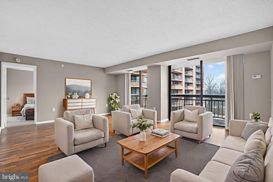 EXCEPTIONAL VALUE for a large unit with tons of light on the quiet side of this amenity-rich building. MOTIVATED SELLER.  Outstanding, modern, spacious unit on the QUIET SIDE of the building.  This unit is light-filled with loads of windows and a big sliding door leading to a spacious balcony.  Kitchen includes maple cabinets, granite counters, and stainless appliances.  Washer / dryer IN UNIT.  For privacy, the two bedrooms are on opposite sides of the unit, each with their own bath and walk-in closet.  TWO ASSIGNED parking spaces, among the closest to the bldg (most units only have 1).  Amenity rich building with tennis and pool (both enclosed with bubbles for winter use).  Spacious grounds with fitness trail plus fitness center in building.  Fantastic location -- walking distance to Metro, but also with free Metro shuttle bus.  Close proximity to Tysons Corner, Beltway, and I-66.  This unit shows well and is an outstanding value.