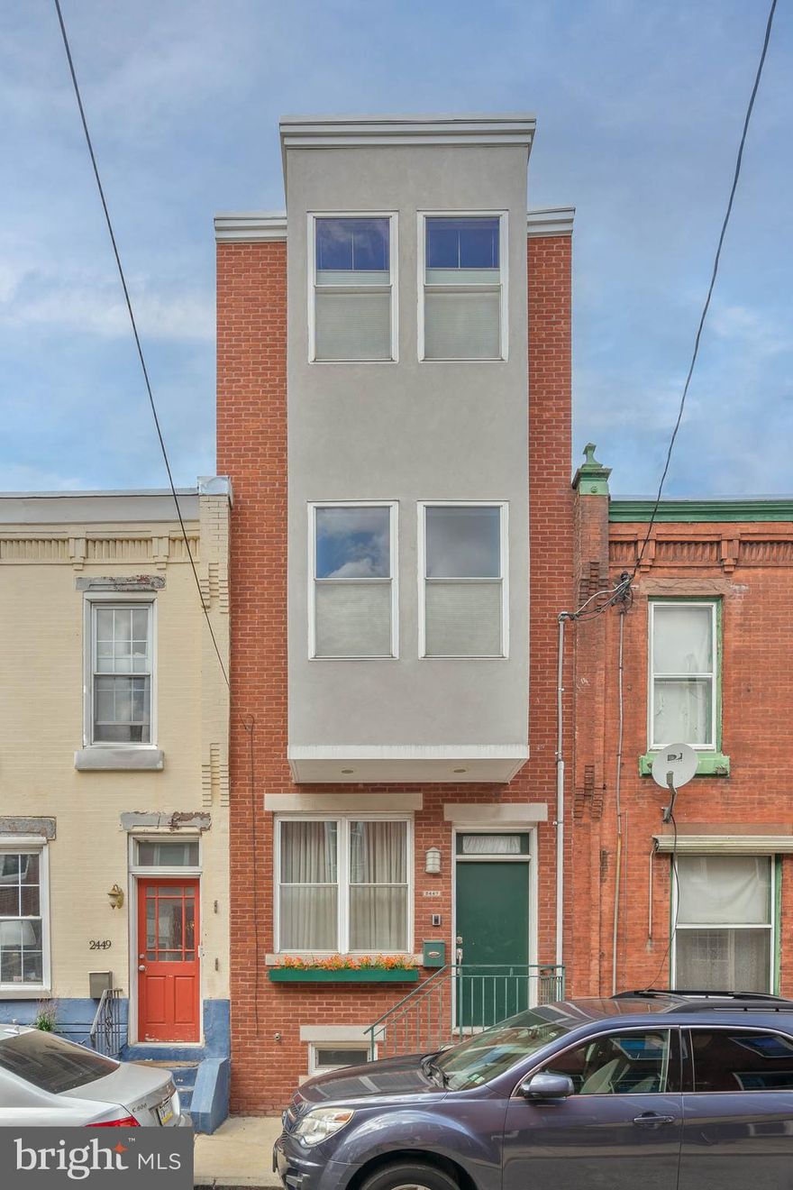 Graduate Hospital is a vibrant community known for its friendly neighbors, local shops, and idyllic parks, and it's where you'll find 2447 Montrose St. This 2,500+ sqft home offers 3 huge bedrooms, 2.5 bathrooms, a finished basement, a private backyard, and a deck off the third floor. A brick exterior facade and a raised entry welcome you into an open, airy main level framed by high ceilings, crown molding, and hardwood floors. Tall windows brighten the living room, while an exposed brick wall anchors the dining area. The sunlit kitchen is fitted with 42" shaker-style cabinetry, granite counters, stainless steel appliances including a wine fridge, a tile backsplash, and an island with seating. A pair of sliding doors open to the idyllic backyard that acts as an escape from the city's hustle where you can barbecue, garden, and dine al-fresco. More living space and a half bathroom are found in the finished basement, perfect for a playroom, gym, or den. This house was featured on "Weekender" Reality TV show which professionally renovated the bedrooms AND basement! The home's second level has two huge, bright bedrooms with hardwood floors and generous closets on opposite ends, flanking a full bathroom and a laundry closet. The top level has a spacious primary bedroom at the front, boasting tall windows, a built-in desk, a feature wall, and double closets. Off the hall is a sleek full bathroom with a dual vanity, a glass-enclosed shower, and a soaking tub. Completing the level is a bonus space ideal for an office, a wet bar, and a rear deck where you can relax with a morning cup of coffee or an evening glass of wine. 2447 Montrose St's fantastic location earns a Walk Score of 90! A few blocks away, South St is lined with unique restaurants, storefronts, markets, and entertainment. The extensive Schuylkill River Trail and Rittenhouse Square are both close, plus there's easy access to public transit, Grays Ferry Ave, Washington Ave, I-76, and The University of Penn. Schedule your tour today! Free, easy on-street parking.