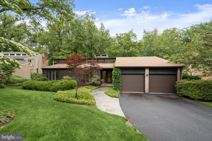 Nestled on a lovely cul de sac in the East Gate of Potomac neighborhood, 8805 Quiet Stream Court is as serene and charming as its name, offering a perfect blend of modern amenities and mid-century modern design. This popular rambler style home presents 5 Bedrooms and 3 Full Baths across 2 elegantly curated levels and 3,652 square feet of pristine living space, boasting a 2-Car, attached Garage, recessed lighting throughout and newly refinished Main Level hardwood floors.
Through the ornamental ironwork storm door, with a side, frosted window, guests and residents alike will be welcomed into the Entry Foyer, boasting a cathedral ceiling, a coat closet and new light fixture. The Living Room includes a dramatic, center stone, wood-burning fireplace, a sliding glass door to the Rear Balcony and a floating wall separating the Dining Room; host friend and family gatherings in this comforting space. The Dining Room showcases cathedral ceilings, a new chandelier and sliding glass door to the Rear Balcony. The fully remodeled Gourmet Island Kitchen boasts tile flooring, custom cabinetry, Caesarstone quartz counters, tiled backsplash, breakfast bar seating, under cabinet lighting and a picture window with Rear Yard views; the ideal craftspace for any at home chef!
The Bedroom Wing Hallway presents beautiful clerestory windows, new light fixtures and a linen closet. The Primary Bedroom includes clerestory windows as well, in addition to cathedral ceilings, a sliding glass door to the Balcony overlooking the Rear Yard, an outfitted walk-in closet, and a Primary Dressing Area, offering a granite topped vanity, framed mirrors, sconces and cathedral ceilings. The fully remodeled Primary Bath embodies a peaceful oasis, offering tile flooring, a single granite topped vanity, sconces, and a stall shower with frameless glass door, tiled flooring and surround. The Upper Level’s offerings are complete with 2 additional Bedrooms, the Second Bedroom including 2 closets, and a fully remodeled, Full Hall Bath, featuring tile flooring, a vanity with a vessel sink, and a jetted tub shower with tile surround. 
Descending the hardwood stairs to the Lower Level, the Recreation Room showcases a center stone fireplace and a sliding glass door to the Rear Patio. The Fourth Bedroom/ Office includes wood-look laminate flooring, a walk-in cedar closet and sliding glass door to the Rear Patio. The Fifth Bedroom includes wood-look laminate flooring as well in addition to full windows; host visiting family for the holidays with ease in either of these 2 inviting rooms. The Fifth Bedroom guest suite features an adjoining Kitchenette with tile flooring, a wet bar and glass tile backsplash; alongside a fully remodeled Full Bath with tile flooring, a stall shower with tiled surround, a bench seat, vanity, and Toto toilet. This Level is complete with a large Utility/Storage Room and Laundry area.

Enjoy the spring and summer sunshine on the brick Rear Patio, overlooking the private Rear Yard backing to parkland. 

In close proximity to Buck Branch Neighborhood Park and Tennis court, Falls Road Golf Course, Potomac Community Recreation Center, Cabin John Village and Potomac Village, 8805 Quiet Stream Court offers residential bliss in a sought after location!