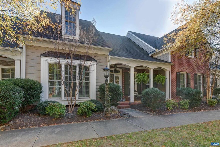 Fabulous low-maintenance, one-level living, courtyard villa in Old Trail.  Walk to shops, restaurants, golf and the pool! Hardwood floors throughout the first floor are warm and inviting. With a soaring great room, large dining room, and open kitchen with stainless appliances, granite counters, coffered ceiling, and maple cabinets, this home is great for entertaining!  The home office features glass French doors for privacy, and a wall of built-in bookcases. The owners suite on the first floor offers a beautiful private bathroom with two vanities, separate tiled glass shower and water closet. Upstairs features a guest suite or second primary suite with private bath, a third bedroom and large unfinished bonus room that could make a fourth bedroom, media room, or exercise room. Enjoy outdoor living in the private, fenced courtyard!,Granite Counter,Maple Cabinets,Wood Cabinets,Fireplace in Great Room