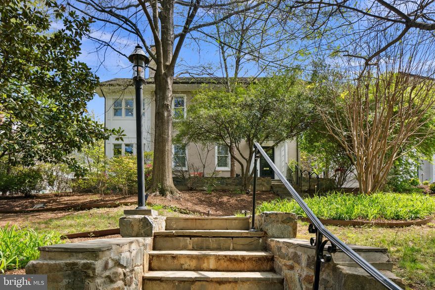 OPEN HOUSES CANCELLED! Spacious and stylish living in the heart of Lyon Village in the Clarendon area of North Arlington. Welcome to this lovely home offering beautifully finished living spaces across four levels, providing versatility for modern living. This residence offers the perfect blend of location, lifestyle, and flexibility. Its unbeatable location allowing owners to enjoy the best of urban-living, with daily errands and outings a breeze without a car. Located directly across from Lyon Village Park, you’ll have a spray park, playground, tennis, and basketball courts just steps from your door. You’re only ½ mile to the Clarendon Metro, with Whole Foods, Trader Joe’s, and MOM’s Organic Market nearby. Even closer the Lyon Village shopping center (Italian Store! Starbucks! CVS!). Commuting is a dream: just two traffic lights to D.C., less than 5 miles to Reagan National Airport (DCA), and minutes from the vibrant energy of Clarendon and Georgetown. This expansive home is designed to meet a variety of lifestyle needs: up to 6 bedrooms and 4.5 baths, including a guest/nanny/au pair suite on the lower level with a kitchenette, private entrance, and refreshed finishes (2021). Two dedicated home offices, one with ample built-in bookshelves, offer space and separation for remote work or study. The main level also features a half bath. The gourmet kitchen (renovated in 2010) is a showstopper, featuring an oversized island with soapstone counters, plumbed for espresso machine, custom banquette seating, bar area, two sinks with disposals, display shelving, and abundant storage. Adjacent to the kitchen, the great room boasts vaulted ceilings, a wood-burning stove, and French doors that open to the patio and private backyard, ideal for indoor-outdoor entertaining. The formal dining room features a cozy fireplace, and a large mudroom keeps everyday life organized. Upstairs, the primary suite is a true retreat, showcasing beadboard detailing, high ceilings, multiple closets, and a spa-like bath completed in 2014 with dual vanities, radiant floor heat, a free-standing soaking tub, and glass-enclosed walk-in steam shower. The suite opens to a bright, well-appointed laundry room for added ease. Two additional bedrooms on this level share a beautifully updated hall bath (2019). The top floor features two more bedrooms with southern-facing skylights, one currently used as a bright playroom, plus another full bath. A detached 2-car garage at the rear of the home, accessed via a rear alley, is wired with outlets for two EVs to charge simultaneously. Over the garage is an additional guest suite with its own bathroom and kitchenette, and even a washer and dryer, offering excellent flexibility for visitors or extended family. This ideally sited and located home ensures its owners spaces to relax, entertain and recharge, yet within easy reach, by foot or car, to shopping, dining, parks and entertainment.