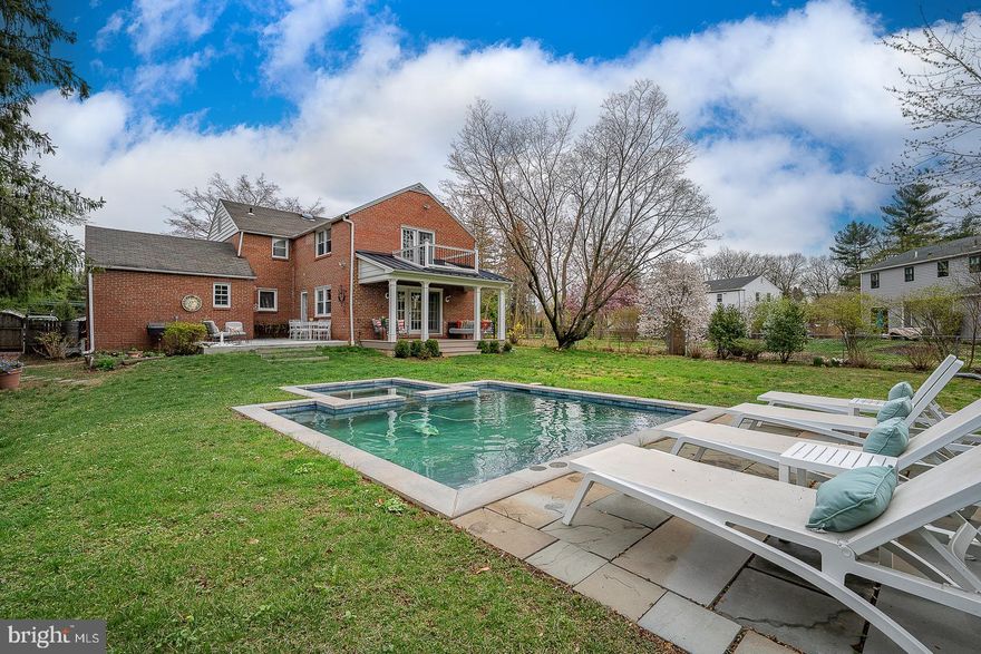 Open House Cancelled
Beautifully Updated Brick Colonial in Prime Walk-to-Wayne Location
Classic charm meets modern living in this expanded and updated brick Colonial, ideally located within walking distance to downtown Wayne, Strafford train station, Radnor Trail, the Farmers Market, and Devon Horse Show grounds.
This home features a spacious first-floor family room addition with fireplace and a second-floor primary suite addition with vaulted ceiling, walk-in closet, and a stunning marble bath with soaking tub, large walk-in shower with linear drain, and custom storage.
Main level includes a fireside living room, formal dining room, updated galley kitchen, mudroom area, powder room, and access to a charming covered back porch and patio. Upstairs offers three additional bedrooms with professionally designed closets and access to a pull-down attic.
Finished basement with bonus living space, storage, and cedar closet. One-car attached garage with interior access and lofted storage.
Set on a flat half-acre lot, the highlight of this property is the gorgeous plunge pool and spa—a true backyard retreat. Every room is filled with natural light. Move-in ready and located in award winning Tredyffrin Easttown School District.
Owner is a licensed Realtor