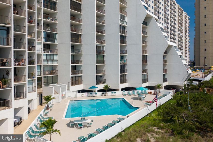 Welcome to your perfect beach getaway!  This direct oceanfront condo is located on the first floor of The Pyramid, one of Ocean City’s most popular high-rise buildings.  It features a spacious bedroom with an en-suite bath, an in-unit washer and dryer, and brand-new flooring throughout.  Step out onto the large balcony and take in beautiful ocean views—an ideal spot for your morning coffee or afternoon happy hour.  This fully furnished, turn-key unit is ready for summer fun.  Whether you're looking for a vacation home or a great rental property, this condo checks all the boxes.  The Pyramid offers fantastic amenities, including a heated outdoor pool, sunny patio, 24-hour security, on-site management, and a rental department to make things easy.  Don’t miss this oceanfront gem—come see it for yourself!