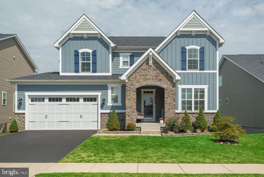 The beautiful single family home has a high end façade with stone, hardy siding and authentic architectural styling, random width hardwood floors throughout the main level, hardwood stairs, a gourmet kitchen with large island, granite countertops, white cabinetry, stainless appliances, walk-in pantry, gas fireplace with stone mantle, loads of windows and natural light, large sunroom extension, luxury extended owners suite with trey ceilings, deluxe owner bathroom with oversized shower, upgraded ceramic tile, dual vanities, huge finished basement with full bathroom and  a patio, large rear deck, cover front porch and New fence. This home has 4 full bathroom and 1 half.  You must see it.