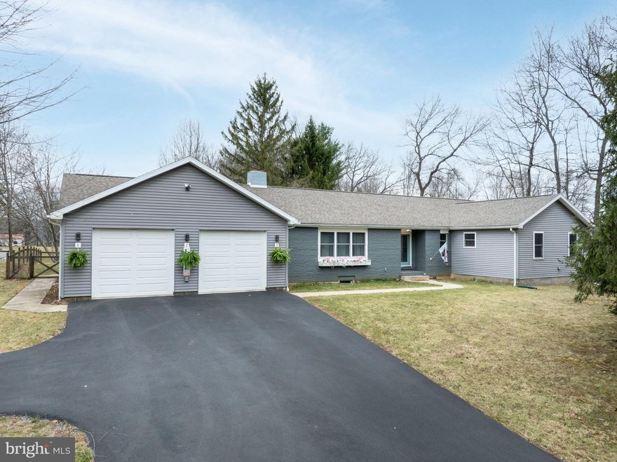 Welcome to 661 Smith Road—a beautifully reimagined ranch-style retreat set on a total of 0.99 acres in scenic Port Matilda. Meticulously renovated by a reputable kitchen and bath remodeler, this 4-bedroom, 3-bathroom home showcases craftsmanship and thoughtful design at every turn.

Inside, you'll find an inviting open-concept layout adorned with engineered hickory hardwood flooring, DuraCeramic tile, and abundant natural light streaming through large windows. The heart of the home is a showstopping kitchen featuring exotic mint onyx countertops, modern lighting, and sleek finishes—an entertainer’s dream with timeless appeal.

A newly added garage provides extra space for storage or hobbies, while the flexible fourth bedroom adds versatility for guests, a home office, or additional living space. Behind the scenes, the home has been thoughtfully upgraded with new PEX plumbing and electrical systems. For added convenience, laundry hookups are discreetly located within the walk-in closet of the primary suite.

The heated and cooled walk-out basement, though unfinished, offers endless potential—whether you envision a one-bedroom apartment, a guest suite, or additional living space. Outside, the fully fenced-in yard offers privacy and security, and an included additional .49-acre parcel (Parcel #17-001A,026-,0000-) expands the possibilities for future development, investment, or added outdoor space.

Perfectly positioned near the expansive Scotia State Game Lands, enjoy direct access to miles of hiking and biking trails right from your doorstep. Currently operating as a successful Airbnb, this property is not only a place to call home but also an exceptional income-producing opportunity.

Don’t miss your chance to own this one-of-a-kind, turnkey property—schedule your private tour today!