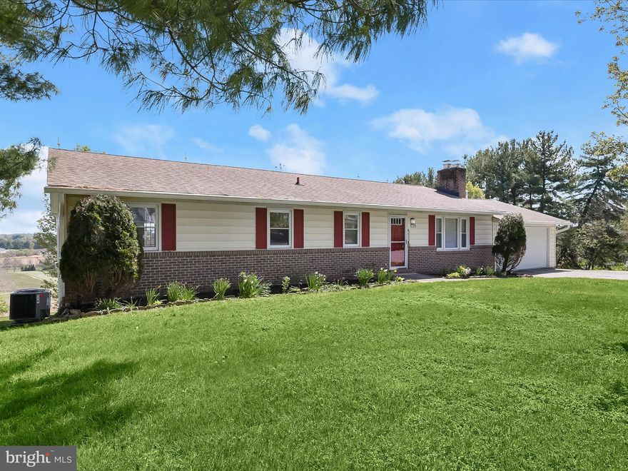 Welcome to 639 Jasontown Road, a fabulous rancher offering breathtaking views and a warm, inviting layout. The spacious living room features gleaming hardwood floors and a cozy fireplace, perfect for relaxing evenings. Classic moldings and hardwood flooring continue into the elegant dining room, which opens to a large deck with stunning panoramic views of the natural surroundings. The eat-in kitchen provides ample cabinetry and space for casual meals. The main level includes a serene primary bedroom with an en-suite full bath, two additional bedrooms, and a second full bath. The finished lower level expands the living space with a generously sized recreation room centered around a second fireplace and walkout access to the rear yard. A fourth bedroom, bonus room, powder room, laundry room, and abundant storage space complete this exceptional home—perfect for both entertaining and everyday living.