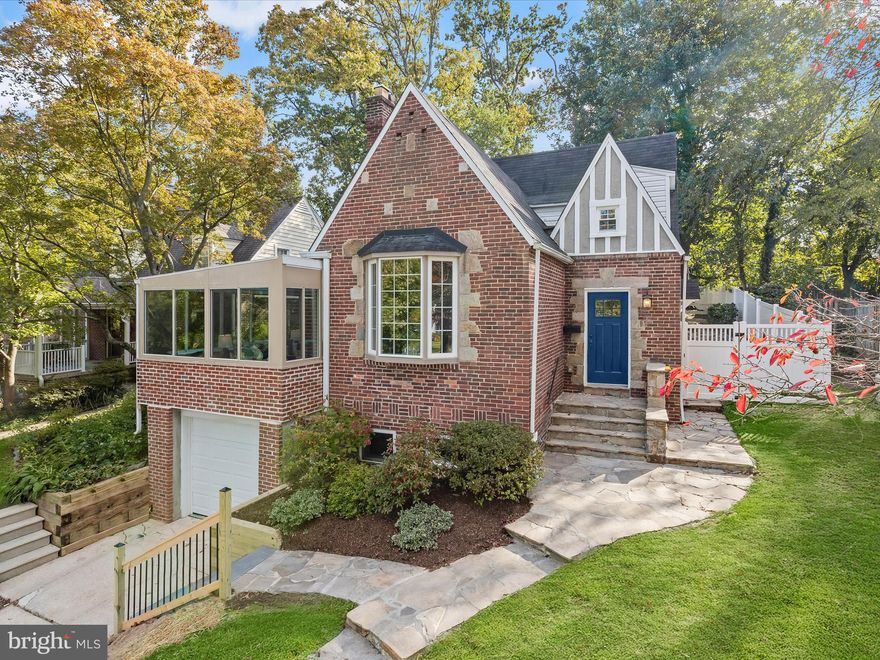 Welcome to this charming brick Tudor-style home nestled in the highly sought-after community of Anneslie, just moments from shopping, dining, and Towson University. Step through the inviting entryway into a stunning living room featuring a cathedral ceiling with exposed beams, a bay window, and gleaming hardwood floors that flow throughout the main level. The main-level primary suite offers a walk-in closet, an en-suite bath with a ceramic tile walk-in shower, and access through French doors to the light-filled solarium, perfect for relaxing with morning coffee or evening sunsets.  The elegant dining room impresses with its soaring ceilings, a sliding glass door leading to the fenced rear yard, and an open layout that is ideal for entertaining. The gourmet kitchen is a chef’s delight, showcasing granite countertops, a subway tile backsplash, stainless steel appliances, 42” soft-close cabinetry, ample storage, and a breakfast bar.  The upper level features two spacious bedrooms, both filled with an abundance of natural light, and one is equipped with a walk-in closet. A convenient hall bath and an overlook to the living room complete this level.  The partially finished lower level offers flexible space for a home office, with access to the one-car garage, a spacious laundry area, and abundant storage. Conveniently located near major commuter routes, including I-95, I-695, I-83, and York Road, this home combines timeless charm with modern updates in one of Towson’s most desirable neighborhoods.