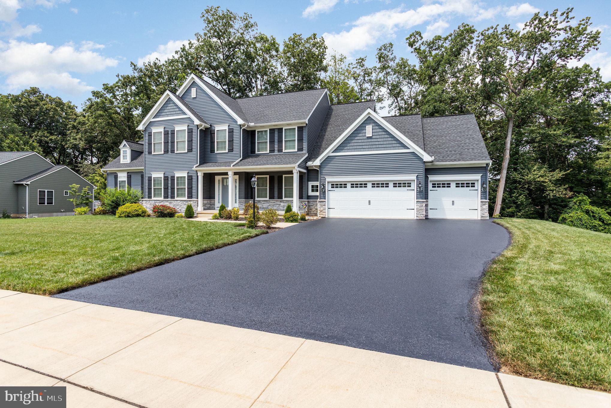 Welcome to this stunning 4-bedroom, 4.5-bath home nestled in a quiet cul-de-sac on a beautifully wooded 1.13-acre lot. With over 3,200 square feet of living space and an approximately 1,500 square feet in the finished basement, this home offers space, style, and functionality. The upgraded kitchen features a large island, modern finishes, and flows seamlessly into the great room—perfect for entertaining. Gorgeous wood floors run throughout home, which also includes a bright sunroom and access to a spacious deck overlooking the tranquil backyard. The finished basement includes a full bath and a kitchenette, offering endless possibilities for an in-law suite, guest area, or additional entertainment space. Workshop is fully insulated and has electric. Practical upgrades include leaf guard gutter covers for easy maintenance. Located in a highly desirable neighborhood with top-rated schools, this home combines privacy, convenience, and exceptional quality.