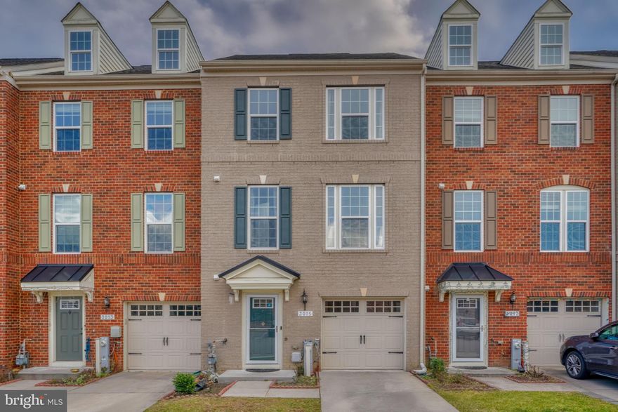 Looking to live in the beautiful Ellicott Crossing community? Look no further than this wonderful 3 bedroom, 2.5 bathroom home. Enter the first floor through your front door or from your attached, one car garage. You and your guests have easy parking in the driveway plus additional, first-come, first-served parking spaces throughout the community. The lower level boasts a large rec room, great for another living space, playroom, or home gym! This level has a couple of closets, plus your tankless water heater and energy efficient HVAC. As you head upstairs, you will be greeted by a gourmet kitchen with stainless appliances, granite countertops, island, breakfast bar, and pantry! Talk about counter and cabinet space! Don't forget about your private deck accessed from the kitchen! The kitchen flows into the light-filled living room, which is close to the powder room and stairs leading to the bedroom level. Hardwood flooring in kitchen, living room and front entry. The third floor boasts a primary bedroom with a walk-in closet and en suite bathroom with a large shower with dual shower heads. This floor is complete with two more bedrooms, a full hall bathroom, and laundry closet. Make use of the community playground, and enjoy being within a short distance to groceries, yoga studio, spa, restaurants, and more!