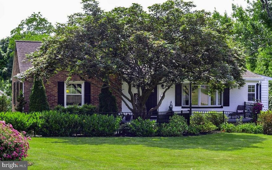 Looking for the perfect blend of comfort and style?  Look no further than this spacious cottage nestled on a landscaped, 1/2 acre lot.  Featuring a beautifully updated kitchen with bamboo floor, gleaming granite countertops and stainless steel appliances.  You'll love preparing meals and entertaining guests in this stunning space. The large living room is perfect for cozy nights gathered around the fireplace.   There's even a sitting room/game nook, perfect for bridge or mahjong!
This comfortable home offers a great alternative to condo living, with surprisingly spacious bedrooms and nice closet space.  Updated ceramic tile bath.  Plenty of room for gardening, relaxing and entertaining.  There's even a garage!
Step outside to the stone terrace surrounded by shade trees and lush landscaping.  It's the perfect spot to relax and unwind in your own private oasis.  Or sit on the covered front porch and say hello to your neighbors as they walk by.
Located in a quiet neighborhood with easy access to great schools, shopping and dining.  Don't miss your chance to make this your forever home!