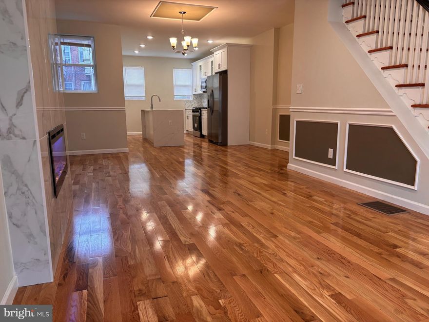 Move right in! This FOR SALE house is conveniently located in a quite Ogontz. This large 4 bedrooms 3 full bath bathrooms home is fully remodeled with elegance and comfort in mind. Open concept layout living and dining area with new hard wood flooring thru out the house, chair and base molding and recessed lighting. Living room also features one of a kind fireplace that is a statement piece. Beautiful chandelier completes a spacious dining room. The kitchen features brand new cabinets with state-of-the-art self-closing doors, quartz countertop, sleek backsplash, and all stainless-steel appliances.  The upstairs offers a master bedroom with on suite bathroom and very large closet; there are two additional bedrooms with plenty of closet space. Second floor also features a European spa like bathroom with imported vanity and elegant tile. No detail was overlooked. The finished basement offers additional flexibility perfect for a home office, gym, man cave it also features 4th bedroom and full bathroom space for entertaining with new carpet.  This property is conveniently located just minutes from shopping, dining, parks and schools, The location is perfect for commuters, as it is near all majors' highways and routes of travel. That's not all, this home features brand new HVAC, electric, plumbing, all permits have been pulled, and all inspections have been passed. Owner is a licensed real estate agent.