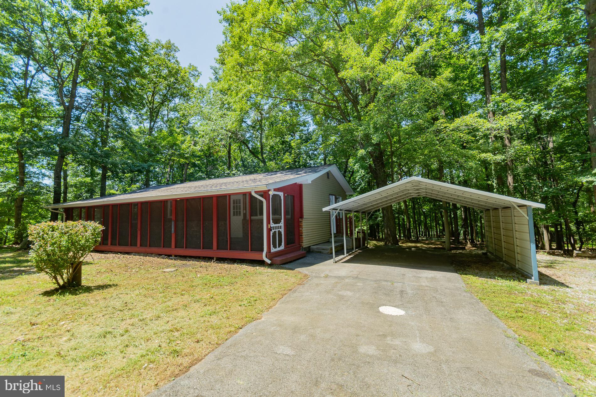 **A Sweet Slice of Harpers Ferry Heaven!**
Tucked away on four peaceful, wooded lots, this freshly renovated rancher is ready to charm you from the moment you arrive. Step onto the spacious screened-in front porch—perfect for savoring rainy afternoons, sunny mornings, or *any* beautiful day Mother Nature sends your way!
Inside, you’ll find three cozy bedrooms, two tasefully updated baths, and a partially finished basement just waiting for your personal touch. With a private well and septic, water softener, a screened-in back porch, two-car carport, and a well-built shed, this home is both comfortable and practical—a true little haven.
It’s the kind of place that makes you exhale and smile. And now with a new lower price... well, you really *should* call today!