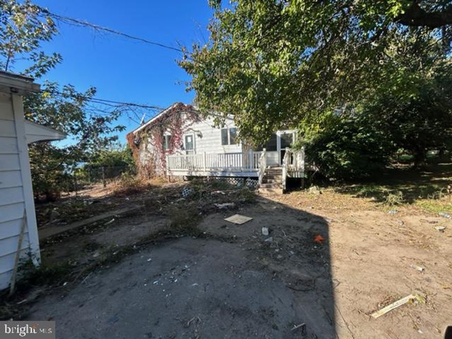 Waterfront property tucked away with deepwater pier with lift on Crab Alley Creek.   The property feature an open floor plan.   Waterview deck off of FR & MBR.    Full Basement, boat house, In ground pool with deck & fireplace.   Detached 2 car gargage and much more!  Great Investment and location!