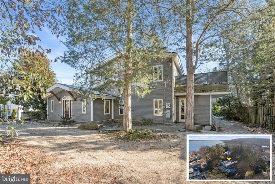 This exceptional residence is nestled in the exclusive, gated and water-privileged enclave of Epping Forest on the Severn River, set within a tranquil landscape of mature trees and lush greenery and offering partial water views. Designed to bring the outdoors in, the home features rich hardwood floors, bamboo accents, stone detailing, and live-edge wood trim, while expansive windows fill the interiors with natural light and frame serene views of the property. A circular driveway welcomes you to the home, highlighted by a stone porch crowned with elegant timber beams, blending organic beauty with refined craftsmanship.
Step inside to generous, flowing main-level living spaces that are open yet thoughtfully defined, creating areas for entertaining as well as peaceful everyday living. Flanking the front entry, a living room and dining room boast soaring vaulted ceilings and recessed lighting, enhancing the airy, sophisticated atmosphere. The kitchen is a study in warmth and functionality, with warm-wood cabinetry crowned with granite that matches the countertops, stainless steel appliances including a gas range, an appliance garage, and a sink beneath a picture-perfect garden window. Additional cabinetry, a pantry with swing-out organizers, and a conveniently located washer and dryer enhance everyday functionality, with easy access from the kitchen to the backyard. The family room opens to a sunlit solarium-style hallway, featuring French doors, two-story windows, and a live-edge wood perimeter that evokes the organic contours of nature. A bonus room off the family room provides additional flexible space for a playroom, hobby room, or home office. The main level also includes a serene bedroom suite with walk-in closet and full bath, complemented by a thoughtfully positioned powder room. A flex area on the main level provides versatile space for a potential home office, exercise room, studio, or storage, with front and rear access and no interior connection to the house. Bamboo railings guide you upstairs and down, reinforcing the home’s harmonious connection with natural materials.
Upstairs, a split layout affords a private primary suite with vaulted ceilings, abundant windows, and an atrium door to a deck with hot tub, overlooking the backyard and treed surroundings. The en-suite bath features a soaring two-story ceiling, stone and glass accents, a dual-head shower, and a walk-in closet with its own washer and dryer. A second bedroom accesses a full bath showcasing natural stone elements, a vessel sink, and an outdoor stone deck with contemporary wood-and-metal railings that blend seamlessly with the wooded landscape.
The finished lower level offers expansive recreation space with two exits. Outdoors, a privacy-fenced backyard features stone patios, walkways, water features, and extensive hardscape, creating a calming retreat. Additional conveniences include reverse osmosis in the kitchen, dual-zone HVAC, and a built-in storage shed.
Epping Forest offers residents a resort-like lifestyle, with a clubhouse, waterside bar and grill, sandy beach, deep-water marina, tennis and basketball courts, walking trails, and year-round community events. Social clubs and activities abound, all within minutes of downtown Annapolis and major commuter routes.
With over 4,000 square feet of thoughtfully crafted living space, this home artfully blends natural materials, light, and serene design, creating a calming, sanctuary-like retreat in a prestigious waterfront community.