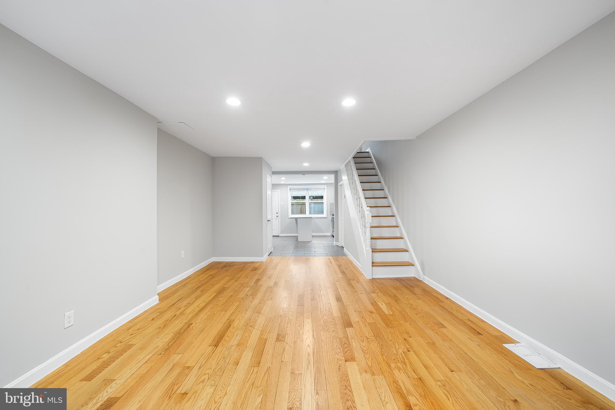 *** 5% down conventional mortgage financing with a below market interest rate is available for this home*** Welcome to 618 McClellan Street, an updated and well kept three bedroom home filled with classic rowhouse charm in the ever-popular East Passyunk Crossing neighborhood. Step inside to the open concept living, dining and kitchen space that features calming neutral gray walls anchored by gleaming mid-tone hardwood floors and is filled with an abundance of natural light from the two front windows. This space is thoughtfully laid out with room for large-scale living room furniture and a dining set. There is even a powder room smartly tucked away between the kitchen and dining spaces. The kitchen features sleek white cabinetry accented by light gray granite countertops and stainless-steel appliances. This kitchen is a unique design with a large center island that not only provides a plethora of counter space but is also the perfect spot for casual everyday dining. The island backs up to a double window that provides great light and has a good-sized ledge to hold all your potted plants. Bonus – there is even a large pantry cabinet seamlessly built-in! The back door is right off the kitchen and offers convenient access to a deck/yard space with ample room for dining al fresco under twinkling string lights and a summer container garden. Upstairs, you will find three bedrooms and the main bathroom. The primary bedroom is light and airy with two tall windows that let in plenty of sun to showcase the room, which even features an oversized closet and a separate, smaller closet that is the ideal space for shoe storage. The second bedroom has the space to accommodate a complete bedroom set. The third bedroom is the smallest of the three and would function well as a home office. All of the bedrooms flaunt the same gorgeous hardwood floors as the downstairs space. The upstairs bathroom has a white vanity for extra storage, which is a nice accent to the slate-colored tile floor. The shower is lined in crisp white subway tile stylishly highlighted with charcoal gray grout. Directly outside of the bathroom, there is a large hall closet for extra storage. The basement is dry with good ceiling height and has a finished separate room for additional living space. This home is truly nestled in the perfect location. In just a few minutes you could walk to BOK Bar for roof top cocktails followed by dinner at Irwin’s or even a delicious lunch at Burrito Feliz. It is also a short walk to all the local favorites along the Passyunk Avenue dining corridor, shopping in the Italian Market and greenspace at Dickinson Square Park with its seasonal farmer’s market. Located in the Southwark Elementary School catchment.