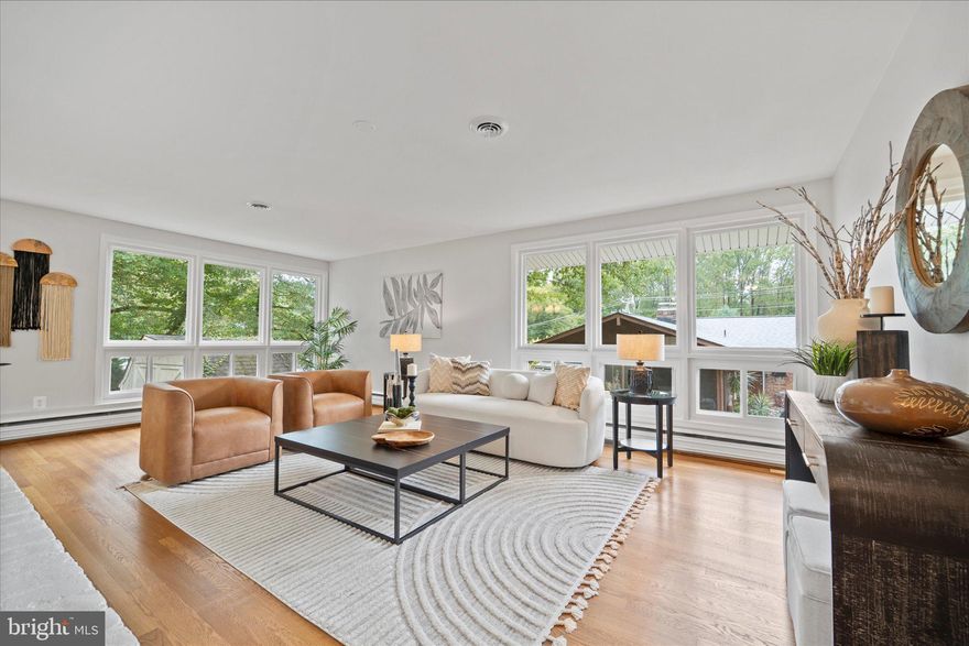 THE ONE you have been waiting for...
Welcome to 10005 Spring Lake Terrace, the quintessential ranch-style home, thoughtfully updated to combine timeless charm with modern living. Set on a beautifully landscaped lot in the desirable Country Club Hills neighborhood of Fairfax, this home offers light-filled living spaces, flexible layouts, and tranquil outdoor living,  just moments from local amenities.
Upon entry, you are welcomed by a spacious foyer with a large coat closet. The main level features a generous living room with two walls of floor-to-ceiling windows overlooking the lush, private backyard. A full brick accent wall surrounds a wood fireplace, creating the perfect spot to relax. The adjacent dining room also boasts floor-to-ceiling windows with serene garden views, offering a seamless connection to the outdoors. The vaulted-ceiling sunroom provides a tranquil setting for morning coffee, dining or entertaining, with a patio door leading to the rear yard.
Three main-level bedrooms and a beautifully remodeled full bath make single-level living easy and practical. The newly remodeled kitchen (2025) features sleek appliances, modern cabinetry, and stylish finishes- ideal for both daily living and entertaining.
The lower level offers exceptional additional space with new LVT flooring, including a warm and inviting family room with a second brick wall and wood stove fireplace. A large fourth bedroom with a remodeled bath featuring a walk-in shower presents an excellent alternative primary suite. Additional spaces include a laundry room and ample storage.
You’ll appreciate the peace of mind offered by major system updates, including a new roof, gutters, HVAC, and windows. Outdoors, the fully fenced backyard is a private haven with a patio, mature landscaping, and a convenient storage shed- perfect for play, pets, or relaxing evenings.
Schools: Daniels Run Elementary, Katherine Johnson Middle, and Fairfax High School.  
Location Highlights:
Prime location close to Fairfax High School, Army Navy Country Club, Fairfax Circle, and the Mosaic District with its vibrant mix of dining, shopping, and entertainment. Enjoy nearby parks, trails, and easy access to major commuter routes including I-66, Route 50, and Route 29 for a quick connection to Washington, D.C., and surrounding areas.
Don’t miss this rare opportunity to own a thoughtfully updated and meticulously maintained home in one of Fairfax’s most sought-after neighborhoods!

Updates & Improvements:
-2025: Full interior painting, new kitchen with modern appliances, renovated main level bathroom, refinished hardwood floors, new interior doors and hardware, updated light fixtures with added recessed lighting, and new LVP flooring in the lower level.
-2023: Basement bathroom renovation, new water heater, added baseboard heaters in basement, sewer line and plumbing replacement, new Carrier HVAC unit installed.
-2022: New roof and gutters, new siding, upgraded windows and exterior doors, boiler (radiant heat) replaced, chimney masonry rebuilt.