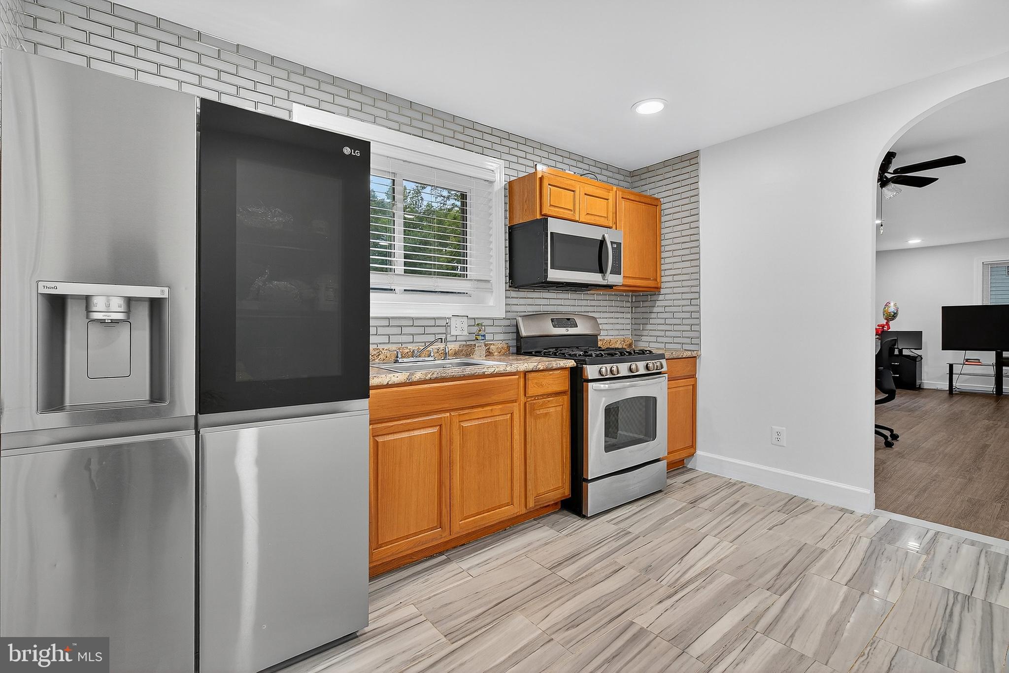 Welcome to this charming and updated rancher rambler located in the desirable District Heights area. This spacious home offers 6 bedrooms and 2 full bathrooms, providing ample space for comfortable living.
Step inside to find a beautifully updated interior. The kitchen features modern appliances, including a large LG refrigerator, a costly full home water filtration system , and stylish backsplash tile. The bathrooms have also been recently updated, with one showcasing elegant marble-style tile and a unique dotted tile floor in the shower. This home offers a fantastic opportunity for energy independence and savings! Included in the sale are fully paid-off solar panels, providing you with the immediate benefit of reduced or eliminated electricity bills. This is a significant value-add that not only saves you money but also increases the home's appeal and future resale value.
The home boasts a versatile floor plan. The lower level offers a large, finished space perfect for a family room or home office, complete with a brick fireplace and a walk-out door to the backyard. The flooring throughout the house is a mix of wood-style laminate and durable tile, giving a clean and contemporary feel.
Outside, you'll find a private driveway for convenient parking and a big backyard, perfect for outdoor activities and entertaining. The property includes two sheds, one of which is a two-level, providing plenty of storage. The roof is only two years old, offering peace of mind for years to come.
This home combines classic rancher style with modern updates, making it a perfect blend of comfort and convenience. Don't miss the opportunity to make it yours!