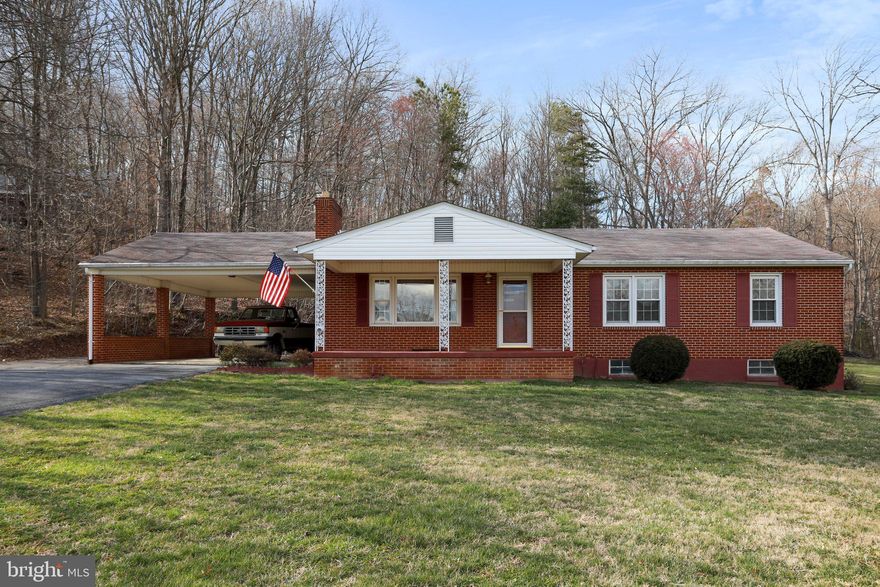 PRICE REDUCED!  What a rare find.  Brick rancher located on almost 12 acres that backs up to Andy Guest State Park.   Offering 3 bedrooms, 1 full bath, hardwood floors,  2 car carport and beautiful views.   Lots of activates in the  area:  from hiking in the National Park to tubing and canoeing on the Shenandoah River. Property is zoned agriculture, which would make a perfect farmette  or homestead.  There are several  large outbuilding  that could have multiple usage such as a  shop, or a barn for animals.  Make your appointment today to preview this great property. Professional photos coming soon.