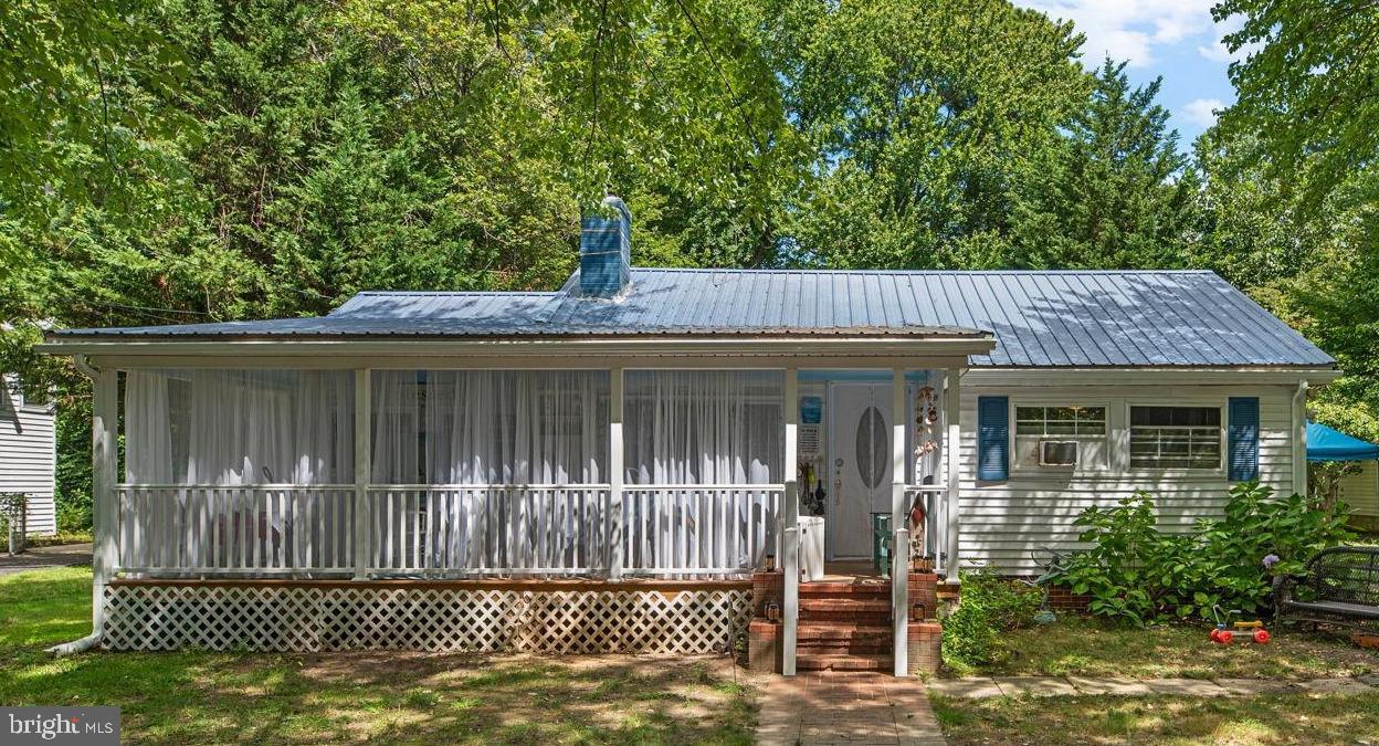 Sweet Chesapeake Bay Cottage just steps from the water! Located in the sought-after Bay City community of Stevensville, this charming home offers water access and unbeatable convenience to the Bay Bridge. Community amenities include a waterfront park with playground, picnic pavilion, kayak/canoe racks, a beach opening to the river, and a pier for small crafts. Shopping, dining, and parks are just minutes away, with easy access to Route 50/301.
The home has been thoughtfully updated with $50k in recent improvements, including a brand-new kitchen with quartz countertops, farm sink, custom cabinetry, new oven, and oversized LG refrigerator. The bathroom was fully remodeled with oceanic tile shower/tub, marble flooring, new vanity, and fixtures. Additional updates include new flooring, fresh interior paint, and a new front porch.
Inside, you’ll find 3 bedrooms with abundant natural light and water views from select rooms. The versatile layout offers expansion potential, with options to convert the front porch into living space or add a rear deck overlooking the spacious backyard. The third-acre lot features mature 200-year-old trees in the front and plenty of open space for a future garage, garden, or backyard retreat. A long driveway accommodates multiple vehicles and even an RV. The home also includes a metal roof and full attic.
Don’t miss the chance to make this Bay City cottage your own—schedule your showing today!