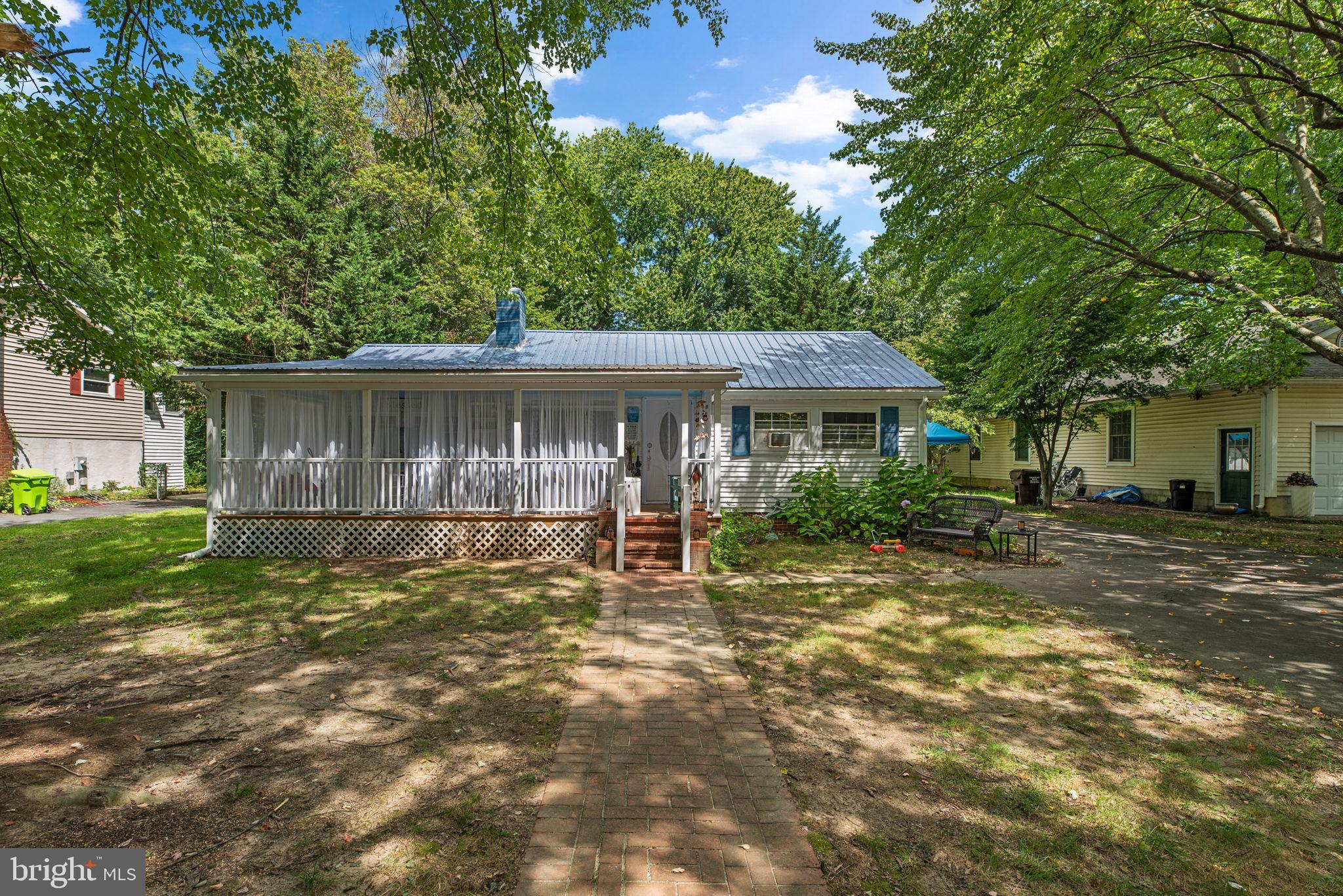 Sweet Chesapeake Bay Cottage just steps from the water! Located in the sought-after Bay City community of Stevensville, this charming home offers water access and unbeatable convenience to the Bay Bridge. Community amenities include a waterfront park with playground, picnic pavilion, kayak/canoe racks, a beach opening to the river, and a pier for small crafts. Shopping, dining, and parks are just minutes away, with easy access to Route 50/301.
The home has been thoughtfully updated with $50k in recent improvements, including a brand-new kitchen with quartz countertops, farm sink, custom cabinetry, new oven, and oversized LG refrigerator. The bathroom was fully remodeled with oceanic tile shower/tub, marble flooring, new vanity, and fixtures. Additional updates include new flooring, fresh interior paint, and a new front porch.
Inside, you’ll find 3 bedrooms with abundant natural light and water views from select rooms. The versatile layout offers expansion potential, with options to convert the front porch into living space or add a rear deck overlooking the spacious backyard. The third-acre lot features mature 200-year-old trees in the front and plenty of open space for a future garage, garden, or backyard retreat. A long driveway accommodates multiple vehicles and even an RV. The home also includes a metal roof and full attic.
Don’t miss the chance to make this Bay City cottage your own—schedule your showing today!