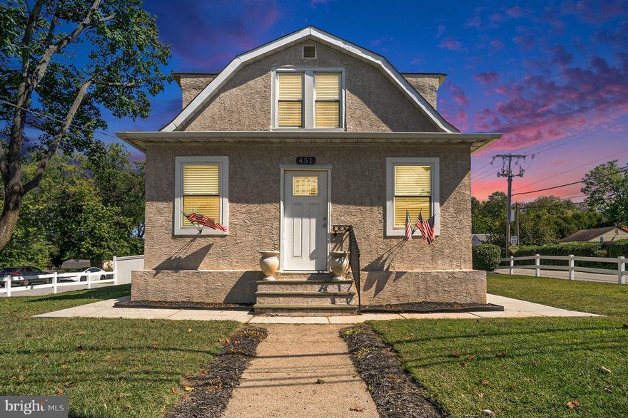 Welcome to an incredible opportunity in Whitemarsh Township and the highly sought-after Colonial School District. This beautifully updated home offers exceptional flexibility, multi-generational potential, and a layout that works perfectly for today’s lifestyle. Centrally located in Lafayette Hill, 451 Ridge provides an easy commute to Philadelphia and the surrounding areas. The property sits on over a quarter acre and includes a fully fenced yard, a detached garage, and a storage shed.

Step inside to a bright, inviting main level where natural light pours through updated windows and reflects off rich hardwood floors. The spacious living room flows into a modern gourmet kitchen featuring quartz countertops, stainless steel appliances, contemporary cabinetry, a tile backsplash, and a brand-new refrigerator. This level includes three generously sized bedrooms and an updated full bath. The large sunroom, complete with ceiling fans and walls of windows, overlooks the backyard and is ideal for enjoying morning coffee or entertaining friends and family. A covered front porch adds another versatile outdoor living space perfect for relaxing or everyday use.

The second level offers incredible flexibility with two additional bedrooms, a second full bathroom, and a renovated second kitchen. This space is perfect for in-laws, extended family, guests, or anyone who appreciates the convenience of two full living areas. A bright open living area upstairs adds even more possibilities—ideal for a media room, lounge, or remote workspace. With separate utilities, multiple entrances, and two laundry setups, the home easily adapts to a variety of living arrangements.

A large, clean basement provides excellent storage. Outside, the beautifully landscaped, fully fenced backyard features a vegetable garden, a compost bin, and plenty of room for play or relaxation. The seamless flow from the sunroom to the outdoor space makes hosting gatherings effortless.

Car enthusiasts, hobbyists, or anyone needing additional storage will appreciate the oversized two-story detached garage with electricity, walk-up stairs, and the ability to charge your vehicle right inside. A full-sized shed and extended driveway with direct street access add even more convenience.

With low taxes, a prime location near major highways, shopping, dining, and public transportation, and the added benefit of being move-in ready, this Whitemarsh gem offers unmatched comfort, function, and value. Do not miss your chance to make this exceptional property your next home.