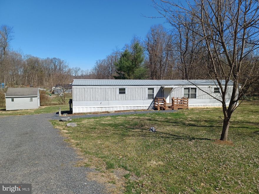 Singlewide on its own 1.04 Ac with storage building.  Community River Access .  Close to MD line and I 81 for easy commute.  Split bedroom layout.  Recently updated and freshly painted.