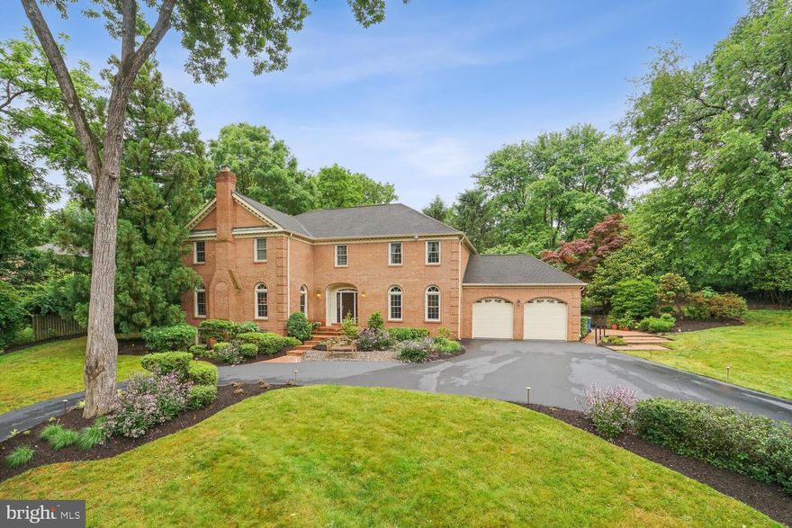 Welcome to the stunning and stately all brick 5000+ sq ft colonial set on knoll on a quiet street surrounded by mature trees and offers a private terrace & garden, and 4 fireplaces.
There are beautiful hardwood floors, crown moldings throughout the main floor, an expansive 25X14 family living and breakfast area with access by tall glass doors that lead to a wedding size brick terrace and a professionally landscaped English garden with 100+ flower varieties. The kitchen offers a commercial size refrigerator and freezer, a 5-burner gas cook top, double oven and convenient microwave under the marble counter. Plus, there is direct access to the generous 22X22 spotless garage with lots of storage along the entire far wall.
Walk in to the main 2 story entrance foyer with marble floors that lead you to the 23X13 Living room with handsome fireplace, or to the15X14 Dining room with elegant Chair and crown molding. Adjacent to the Living Room is a 13X13 Study or Den with wet bar plus storage for books or bottles. Plus, a conveniently located powder room around the corner.
The second floor has 4 bedrooms with 3 bedrooms & 2 baths for family and guests including the primary 22X14 suite with fireplace, that enjoys a 14X17 clothes horse dressing room with a wall of closets, plus a generous walk-in closet. In addition, there is a 7X5 walk in closet across from the His and Her vanities with half bath and next to a private tub and shower bathroom with vanity sink.
The enormous, finished walk out lower level 23X40 Family Room has a cozy area with a brick fireplace surrounded by built ins including a wine refrigerator, wet bar, drawers and bookcase. Presently used as an office, but great as a play area for kids. In addition, there is an extension to the family room that seems perfect as a fitness room. Lots of storage and full bathroom that includes a 2-person steam shower. 
 The school district includes Spring Hill, Cooper, and Langley HS.
Located in one of the most sought-after neighborhoods in easy proximity to downtown McLean, and walkable to a convenient shopping area including a grocer, pharmacy and florist.
