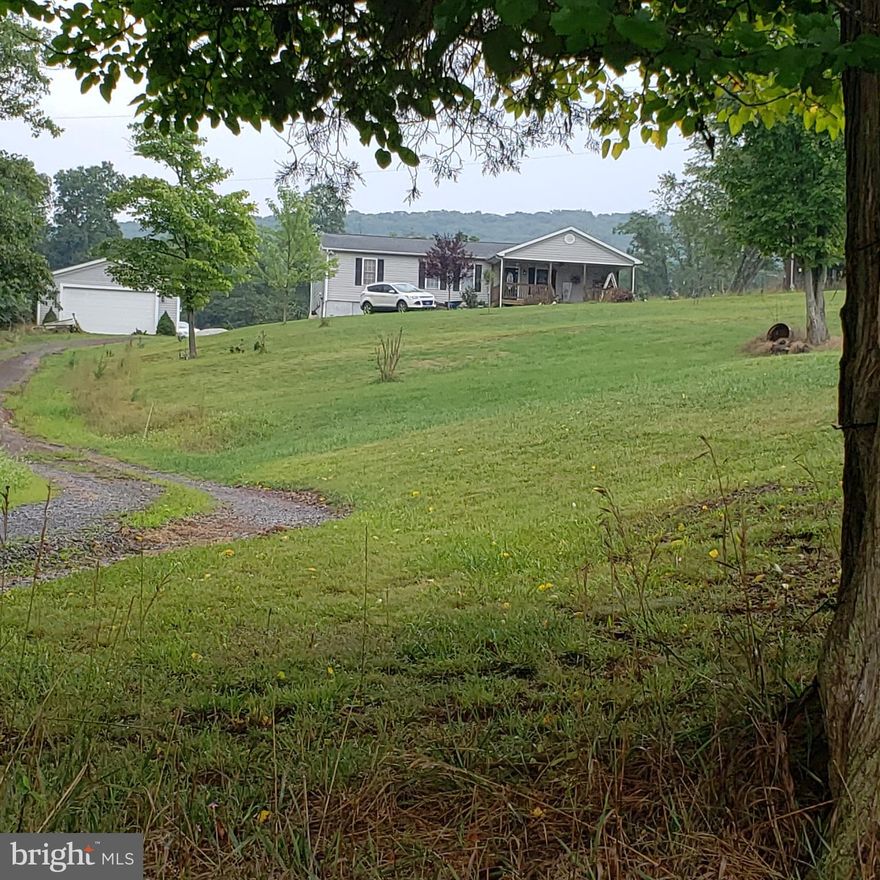 Adorable rancher on 2.5 acres with incredible views from you front porch.  Just 7 miles off Route 522 for an easy commute. Just 40 minutes to Martinsburg, WV or 25 minutes to Winchester! Peaceful and private. Sit out on your front porch and enjoy the views, or grill out on your back deck and watch the wild life.  Plenty of space for a large sunny garden. Property is unrestricted, bring your goats and chickens too!  House features beautiful hardwood floors, large kitchen, and you can save $$ heating with the pellet stove is you prefer.  Separate laundry/mud room with just like new washer/dryer. Multiple offers, all offers must be submitted by 5:00 PM Tuesday 9/1/2020