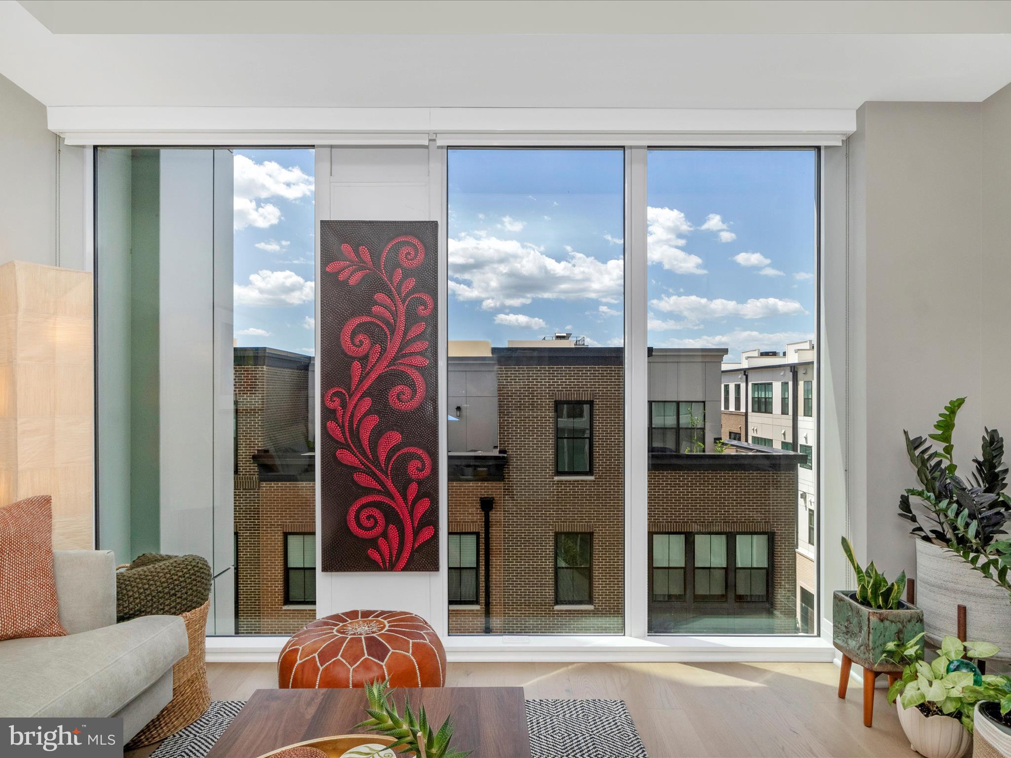 Now is your opportunity to own an amazing place to call home at the ever popular Venue, Old Town's deluxe condominium building. Make your appt. today to tour this amazingly charming ONE BEDROOM + DEN- and this den is **large enough to be utilized as a guest/2nd bedroom**. This special residence is flooded with natural light and a gorgeous view of the sky. The smartly designed floor-plan utilizes the space with precise purpose, so it flows a bit larger than than 875 sq ft. The builder designed the interior finishes to maintain a certain standard for their owners : finishes in this condo include a chef's kitchen, featuring an upgraded appliance package, milky white quartz countertops with coordinating backsplash and custom cabinetry. The VENUE offers a turn-key way of living with a massive lobby staffed with a concierge to assist you and on-site building manager to handle your requests. The amenities here are truly astounding as the building offers a sprawling Rooftop Terrace w/expansive views of the Potomac River, DC Monuments, National Harbor and a classic Old Town skyline. In the mood to grill ? Well you can with their outdoor grilling area and there is a fire pit spot for those colder nights. There is a stunning indoor sky lounge area that offers more than just amazing views.... there is a cocktail bar, fireplace + flat screen TV. The fitness center is state of the art and includes a Barre studio ! If location is everything, then the Venue IS IT. You are in the center of great restaurants, shopping, Mount Vernon Trail and a short ride to DCA to fly out of town. One assigned covered parking space conveys. Make an appointment to see this one today and see what living the Venue lifestyle is all about.