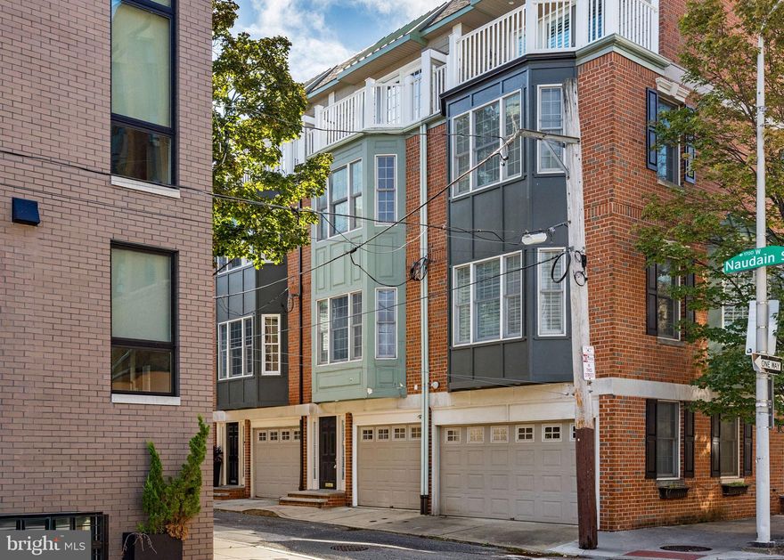 Welcome to 1740 Naudain Street, a sophisticated four-story townhouse in the heart of Philadelphia. This home boasts 3 well-appointed bedrooms and 2.5 luxurious bathrooms.  Located in the Greenfield School Catchment. 

The ground level offers a spacious entryway perfect for storing personal items, alongside a convenient attached garage, a powder room, and a laundry room. Step up to the second floor and be greeted by oversized windows that flood the space with natural light, highlighting the high ceilings and a beautifully renovated kitchen. 

The modern kitchen, featuring an eat-in dining area and access to a deck, is ideal for entertaining or enjoying morning coffee. The third floor provides two generous bedrooms, each with ample closet space, and a full bath with a tub.

The fourth-floor master suite is a private retreat, complete with custom built-in closets, dual his and her closets, and a charming balcony offering breathtaking city views. The master bath is a spa-like oasis with a Jacuzzi tub, walk-in shower, and double vanity. Additional amenities include central AC, central heating, and a full basement ready for your personalized touch. 

Experience modern elegance combined with urban convenience at this exquisite property. Plus, enjoy the vibrant city life with Rittenhouse Square just a short stroll away, offering a delightful mix of shopping, dining, and leisure activities in one of Philadelphia's most iconic neighborhoods.