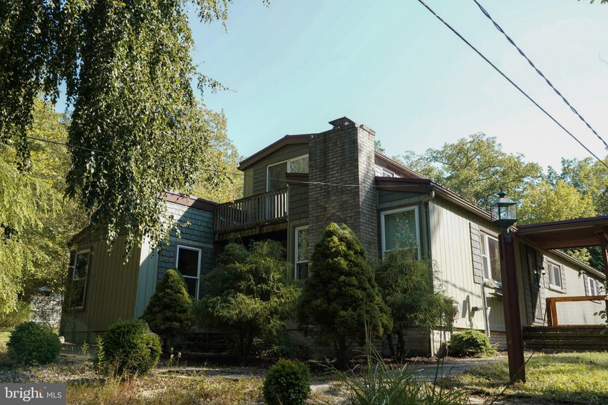 Nestled in the mountains on highly desirable Black Moshannon Rd., this single-family home offers a balance of peaceful living with convenient access to nearby cities. Located just 25 minutes from State College, 20 minutes from Clearfield, 10 minutes to Black Moshannon State Park, and 2 miles from Philipsburg Osceola Elementary, you’ll enjoy a quiet mountain retreat with quick commutes. Grab your ATV/UTV and hop on the Snow Shoes Rails to Trails system with a trailhead only 1 mile down the road.

This 3-bedroom, 2-full bath home features 1,885 sq. ft. of living space on 0.91 acres with an additional large basement that is partially finished and dry. Step inside to a large, inviting entryway with exposed ceiling beams, an Amish-made kitchen with soft-close cabinetry, and a cozy upstairs bedroom with a private walk-out balcony. The guest bathroom includes a clawfoot tub and antique-style vanity, blending modern comfort with vintage charm.

Enjoy the outdoors with a spacious fenced backyard, 16' x 16' gazebo, stone patio, and fish pond. A pear tree produced over 50 pears this year. Being surrounded by state game lands, wildlife visit the property daily. Additional features include three detached storage sheds, a chicken coop, two driveways for ample parking, and a stone retaining wall in the forward landscaping.

This quiet retreat is perfect for families, commuters, and anyone seeking the tranquility of mountain living with modern conveniences.
Listing agent is owner of property.